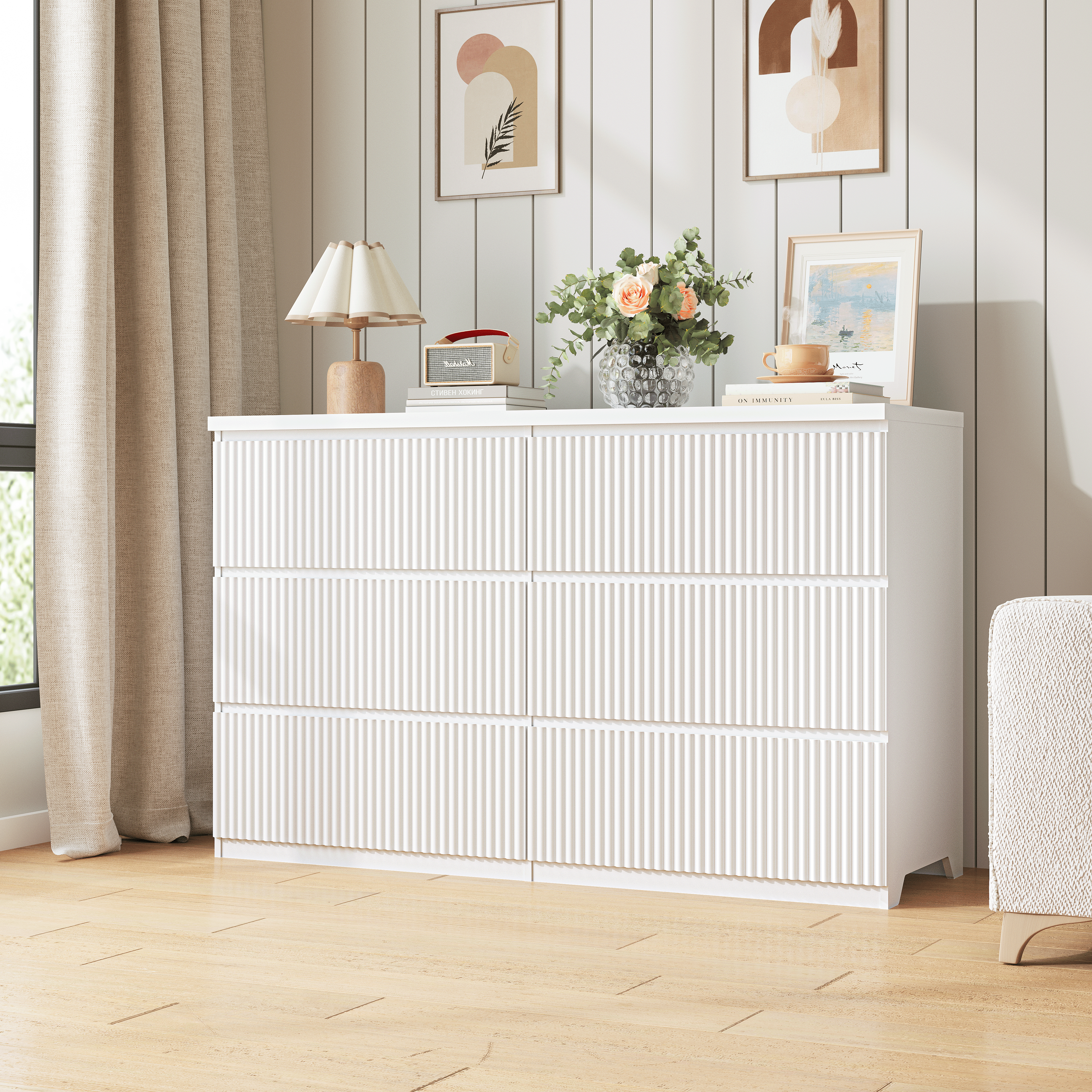 Modern white chest of drawers styled in a bedroom setting