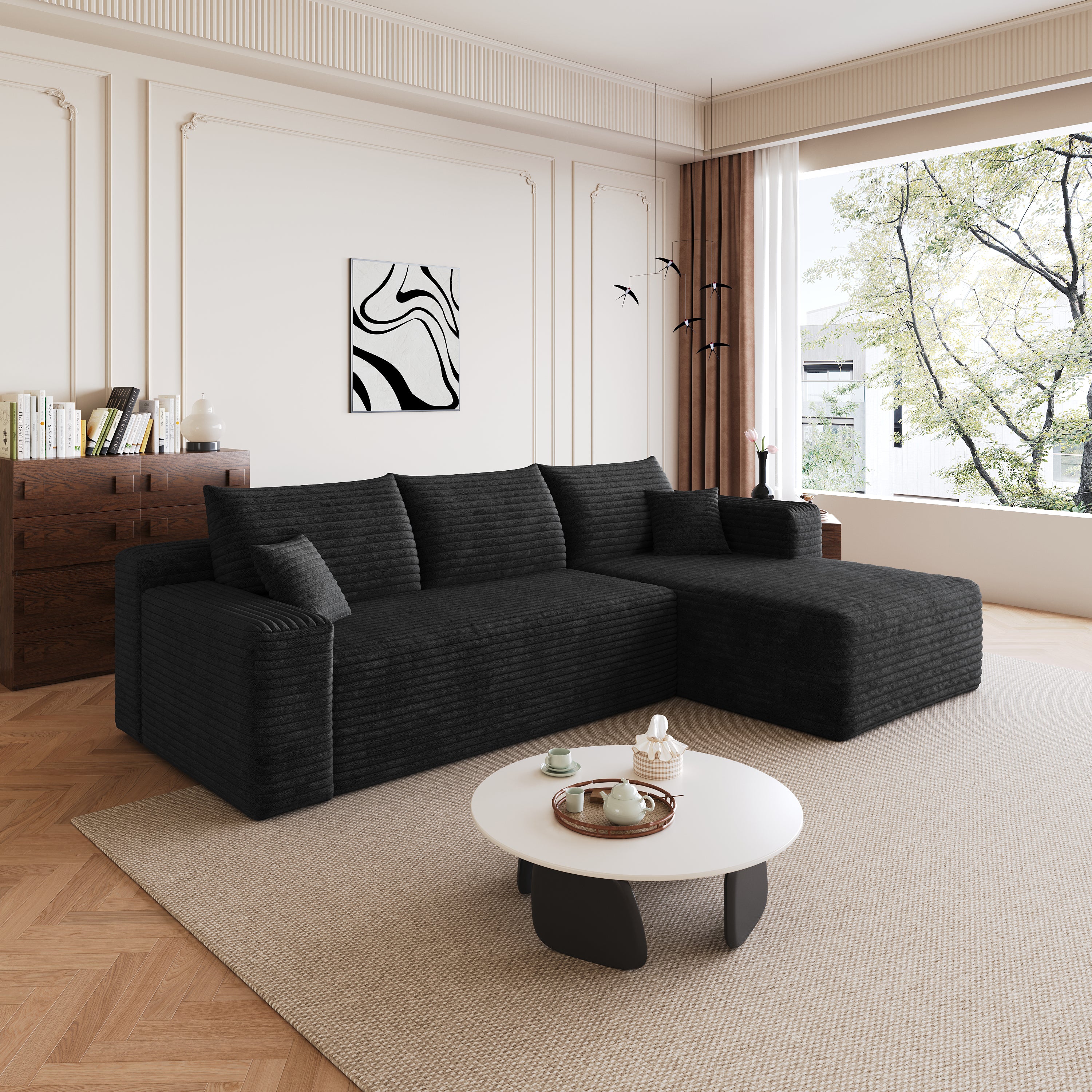 Black corduroy sectional sofa, plush cushion detail close-up
