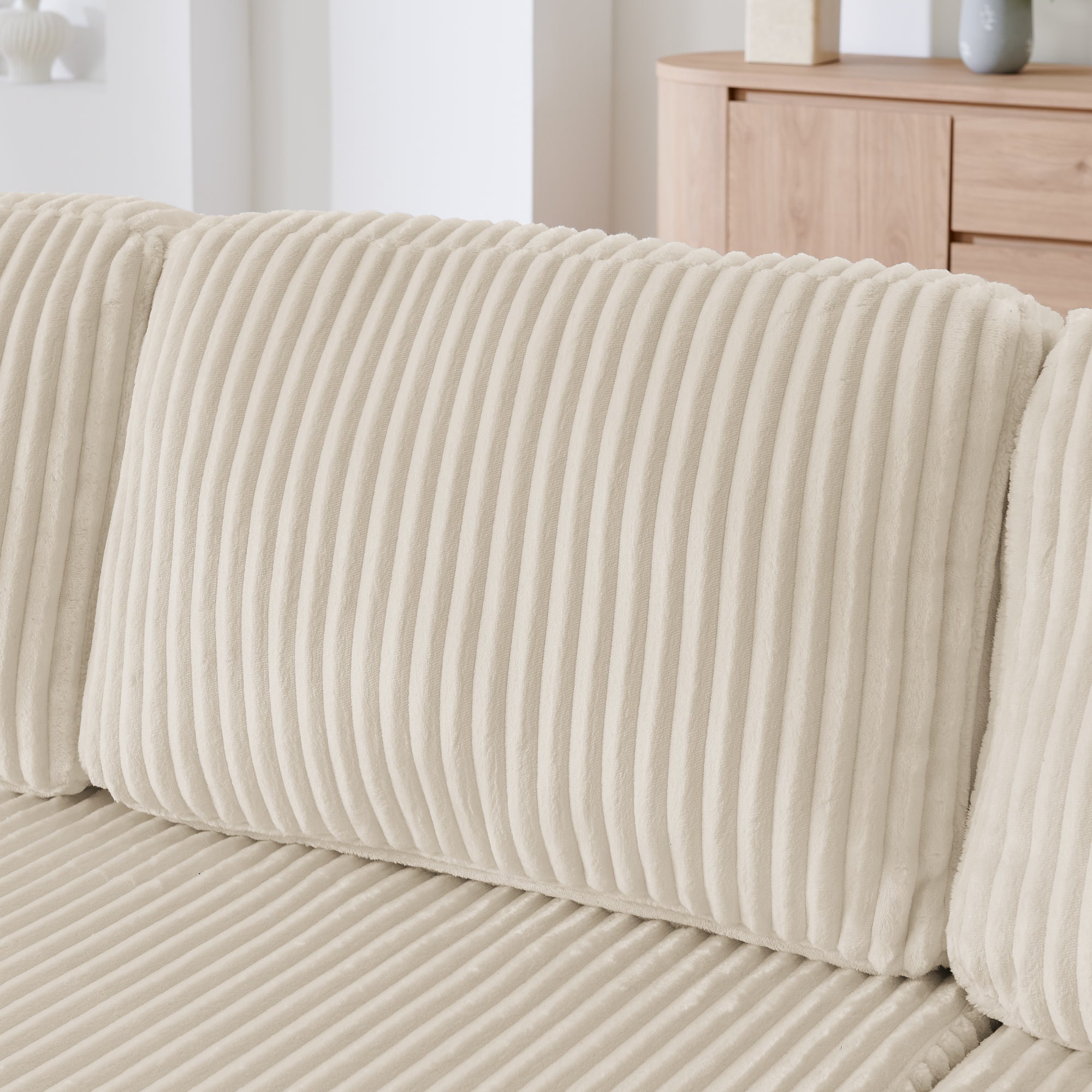 Modern minimalist U-shape sectional sofa in beige, living room setting