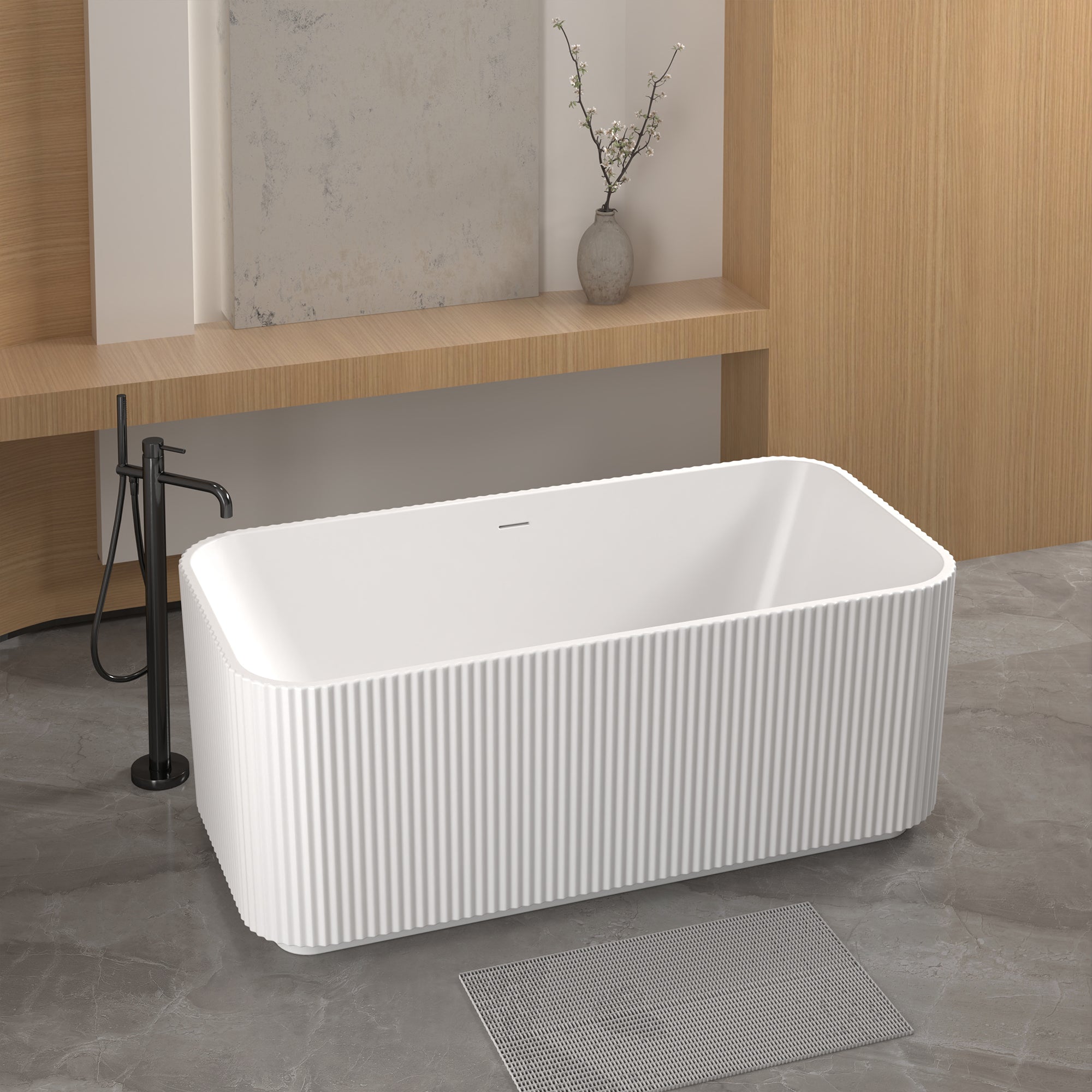 Glossy white freestanding acrylic bathtub, angled side view