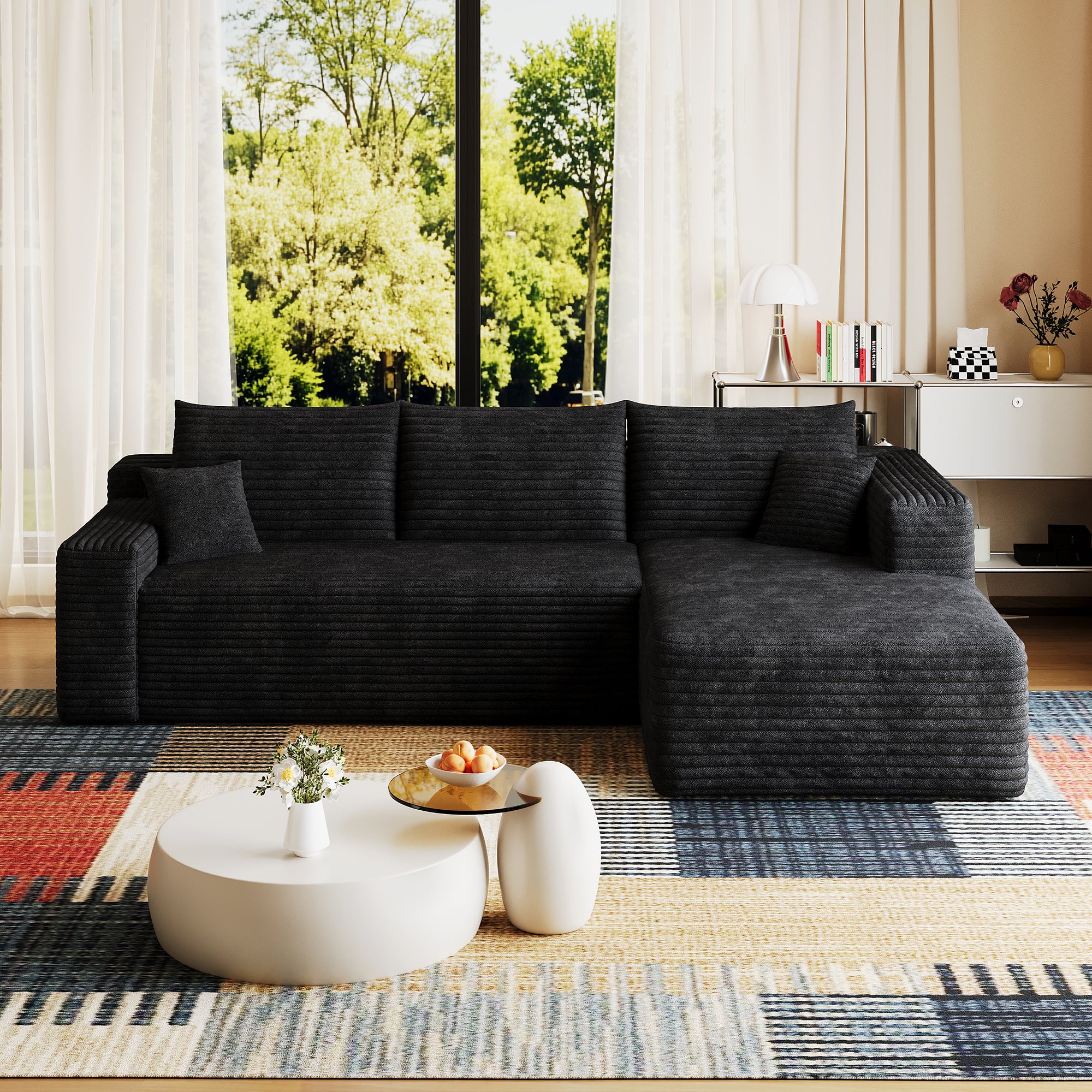 Black corduroy sectional sofa side profile showing deep seat