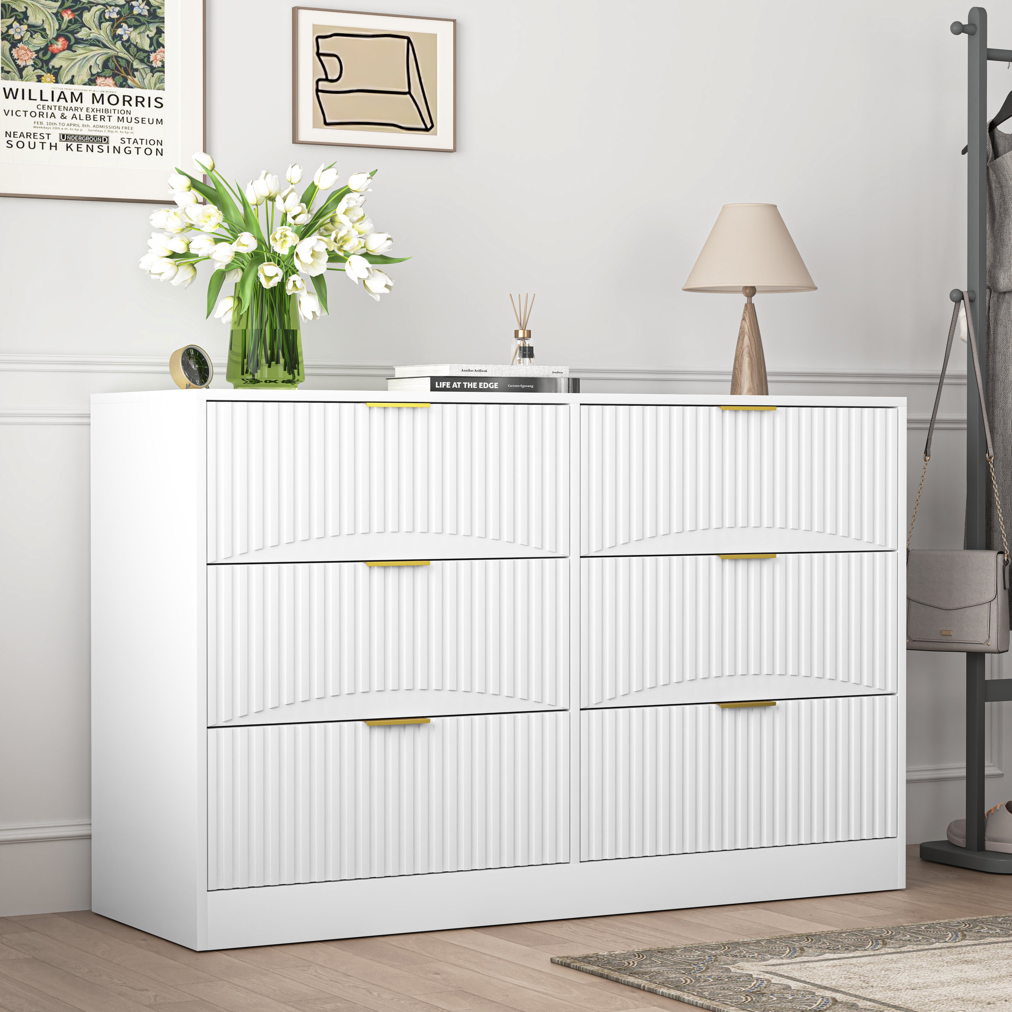 White modern chest of drawers styled in a bedroom setting, room view