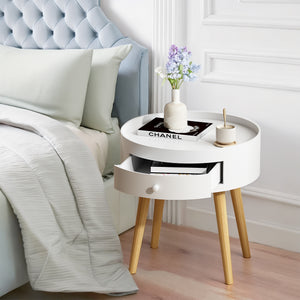 White nightstand with oak legs and storage drawer, front view
