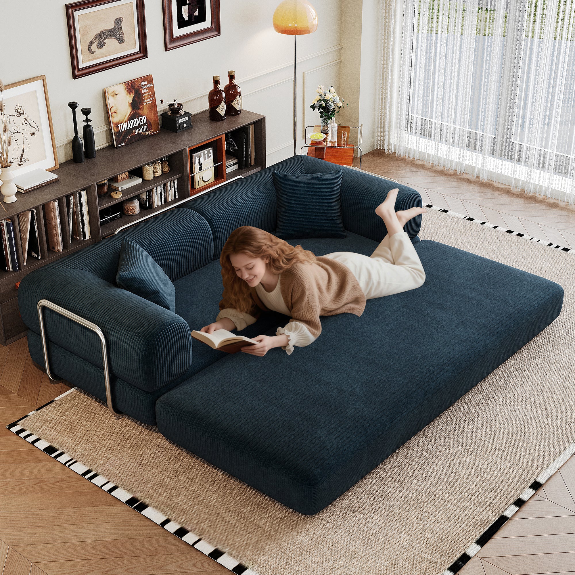 Blue corduroy sofa bed folded into flat floor bed, angled view