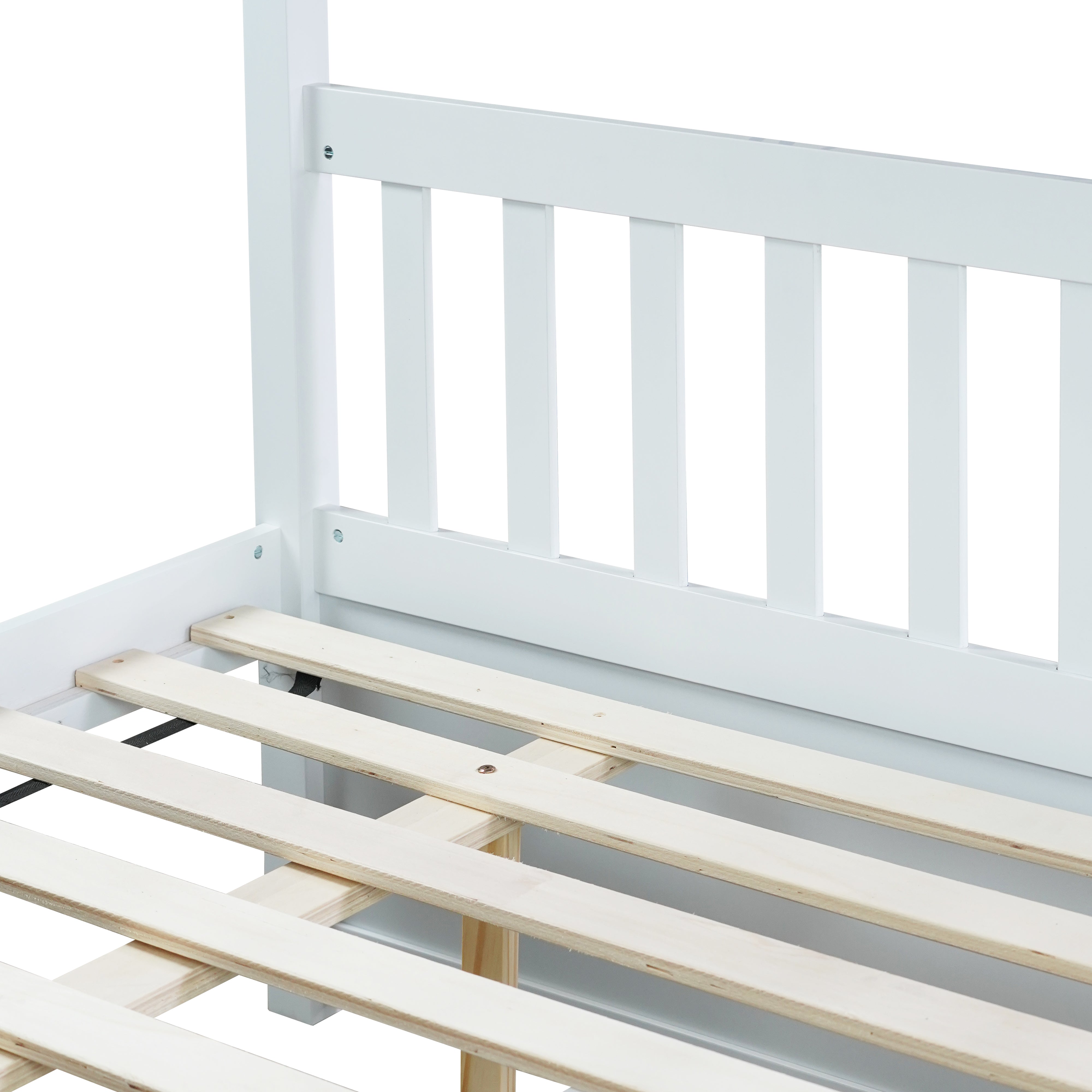 White full over full bunk bed with trundle rolled out, angled view
