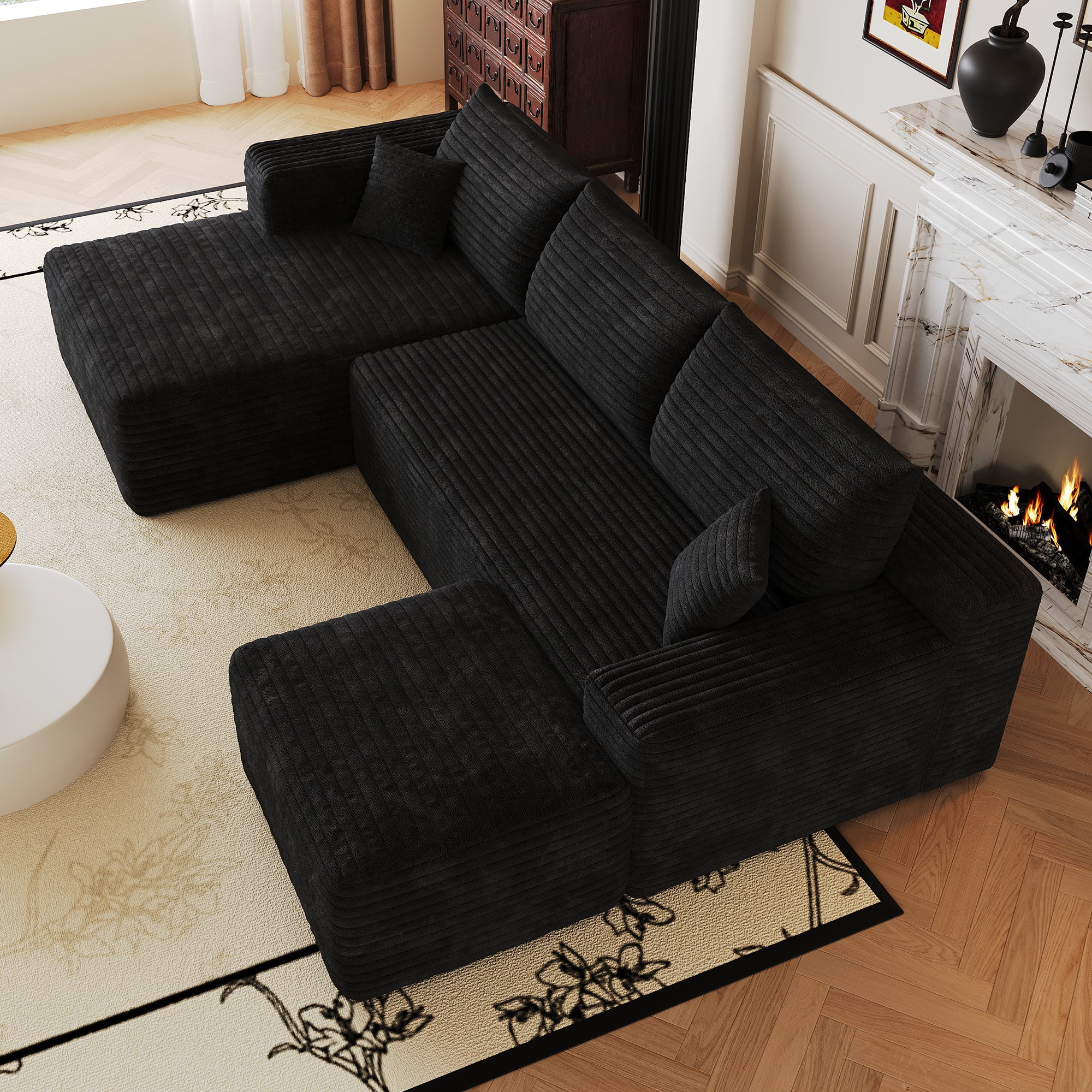 Black L-shaped sectional sofa corner configuration full view