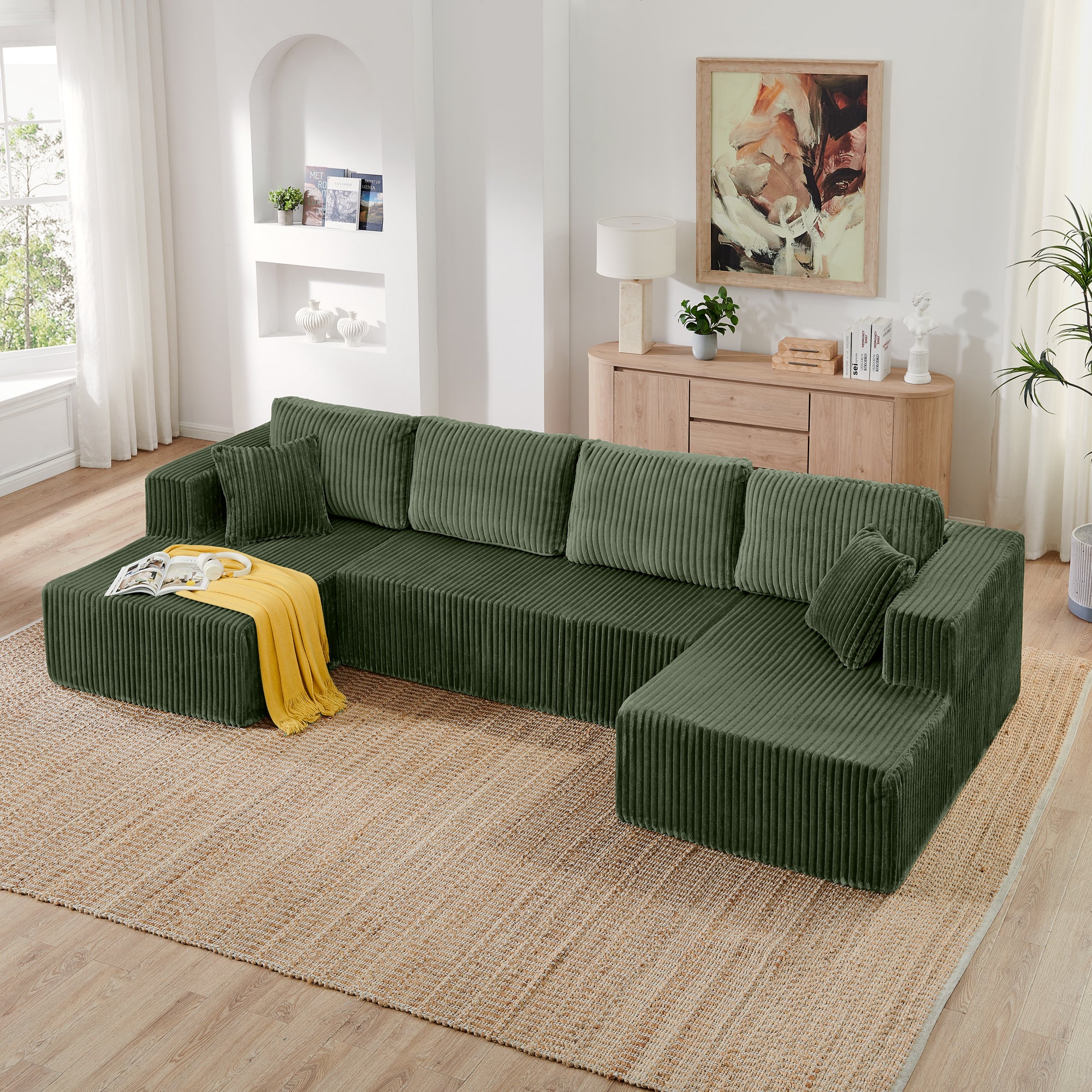 Green corduroy U-shape sectional sofa, angled view