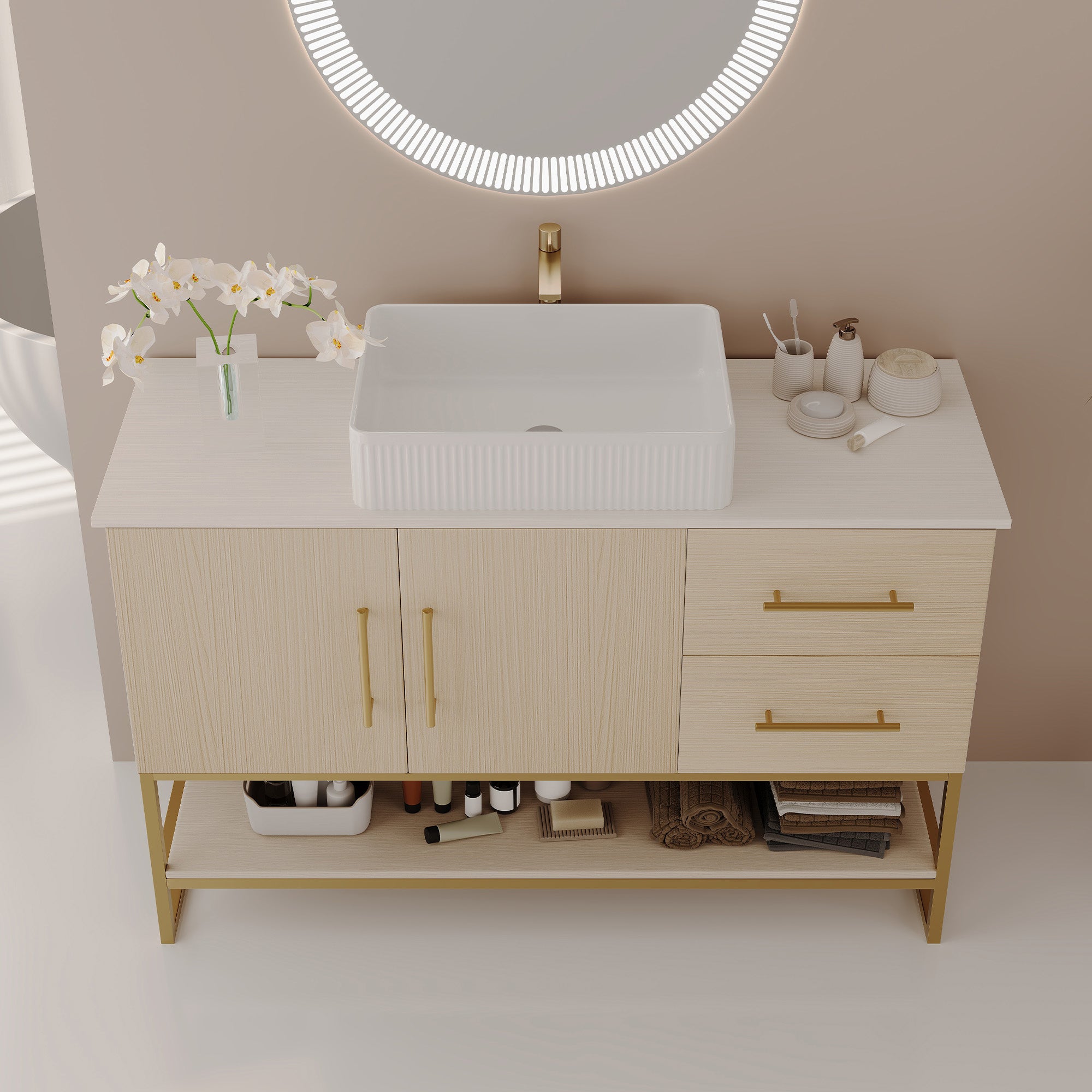 Modern gold-accent bathroom vanity with ceramic vessel sink, styled room view