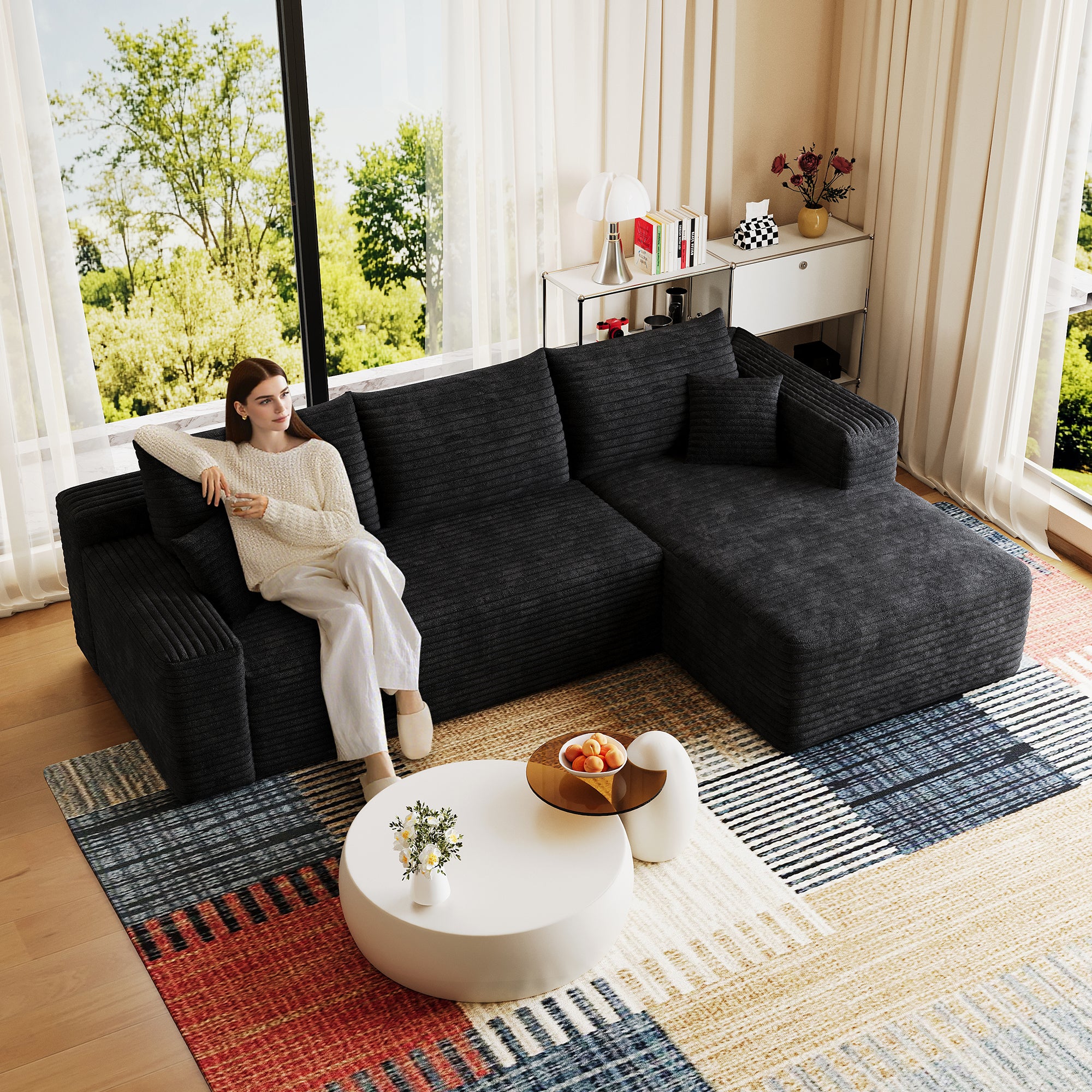 Black corduroy sectional sofa deep seat cushions close-up