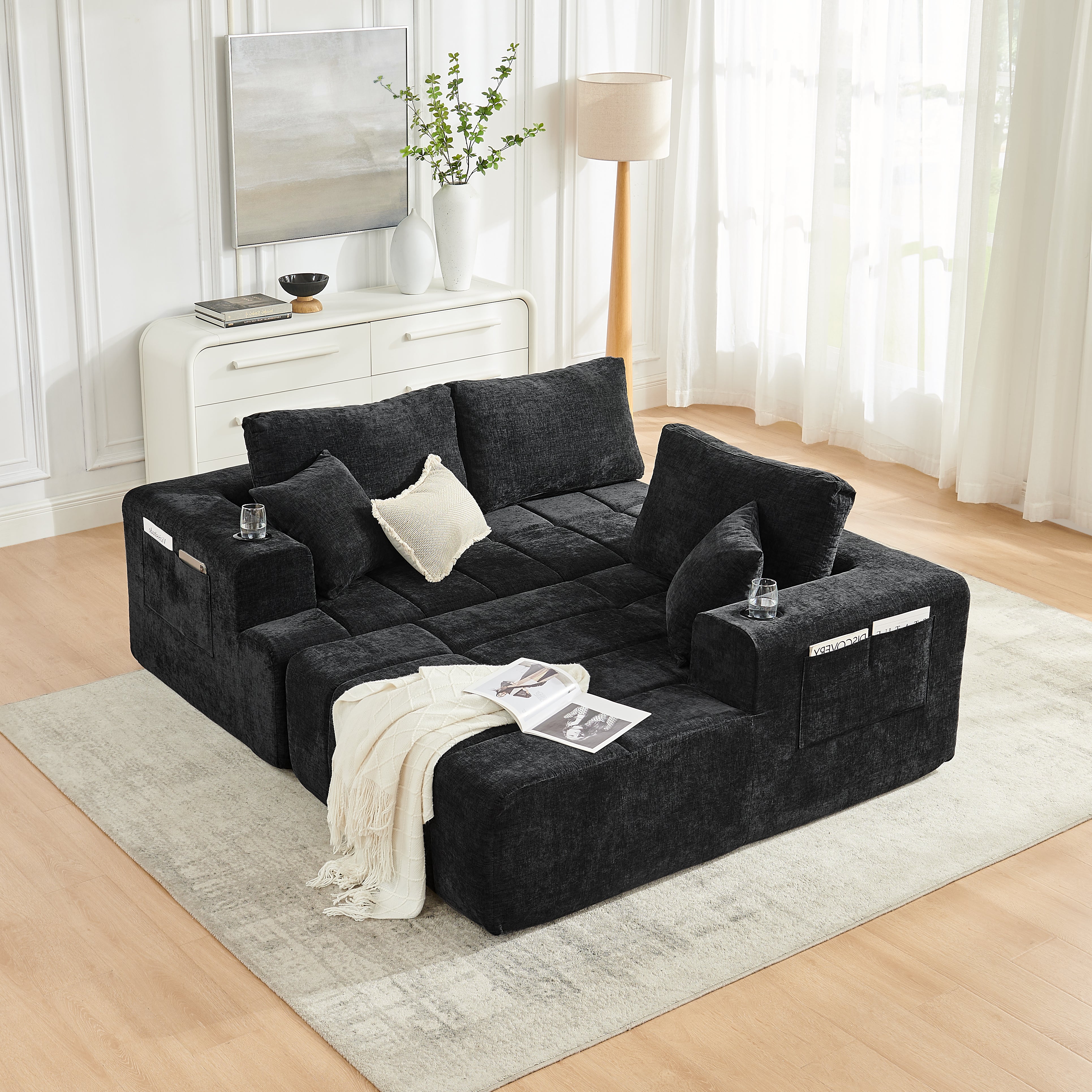 108 inch black sectional sofa with side pockets, living room setting