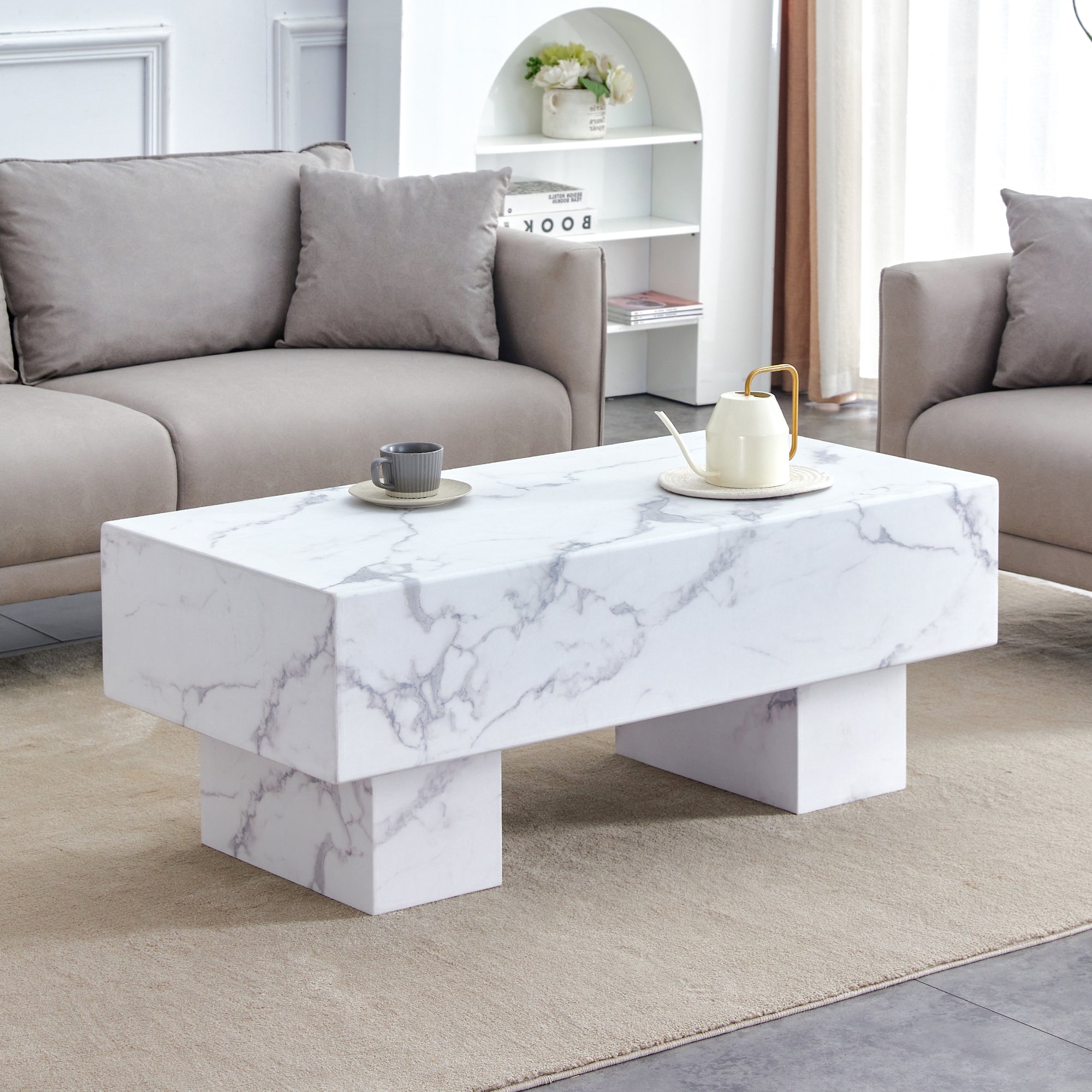 The white coffee table has patterns. Modern rectangular table, suitable for living rooms and apartments. 43.3"*21.6"*17.2"