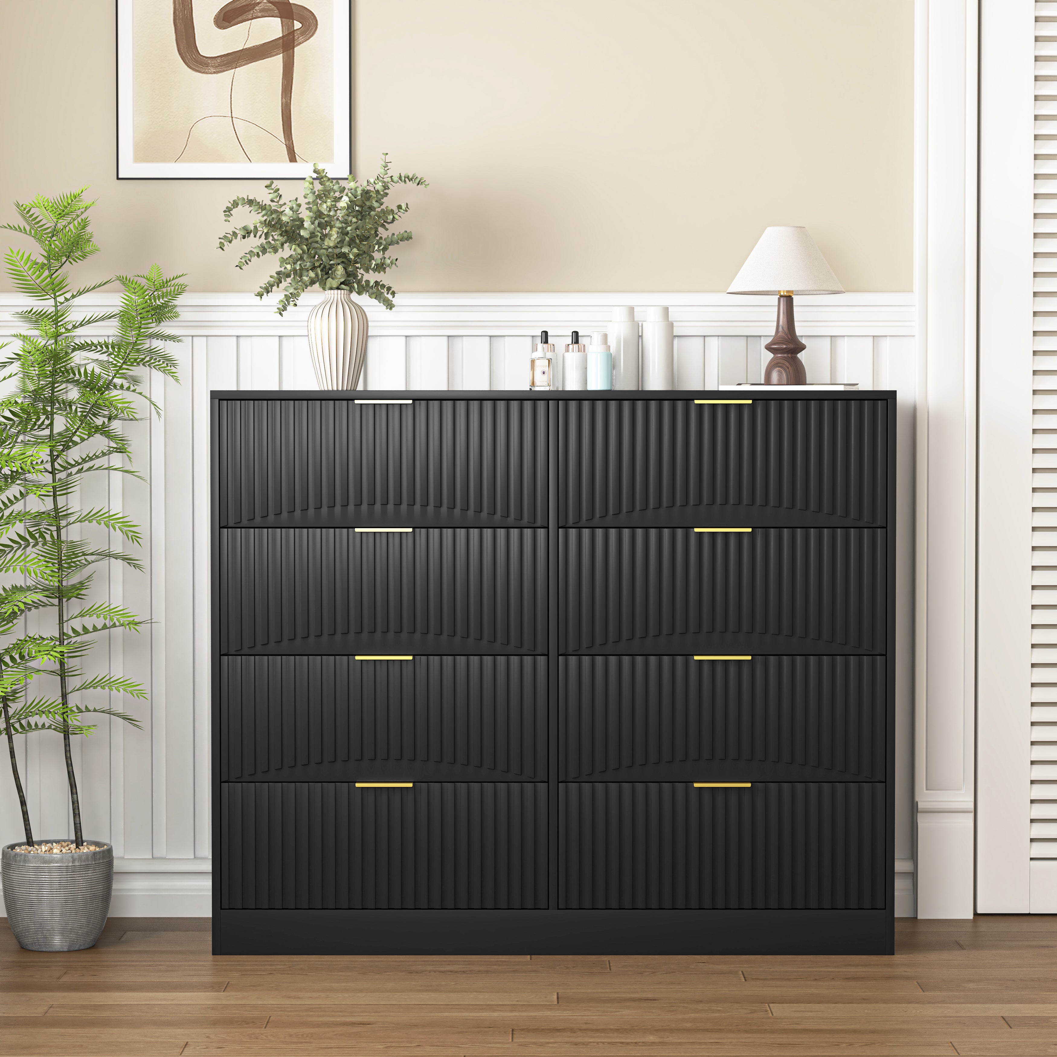 47.2 inch wide black wood chest of drawers with gold metal handles, styled in bedroom