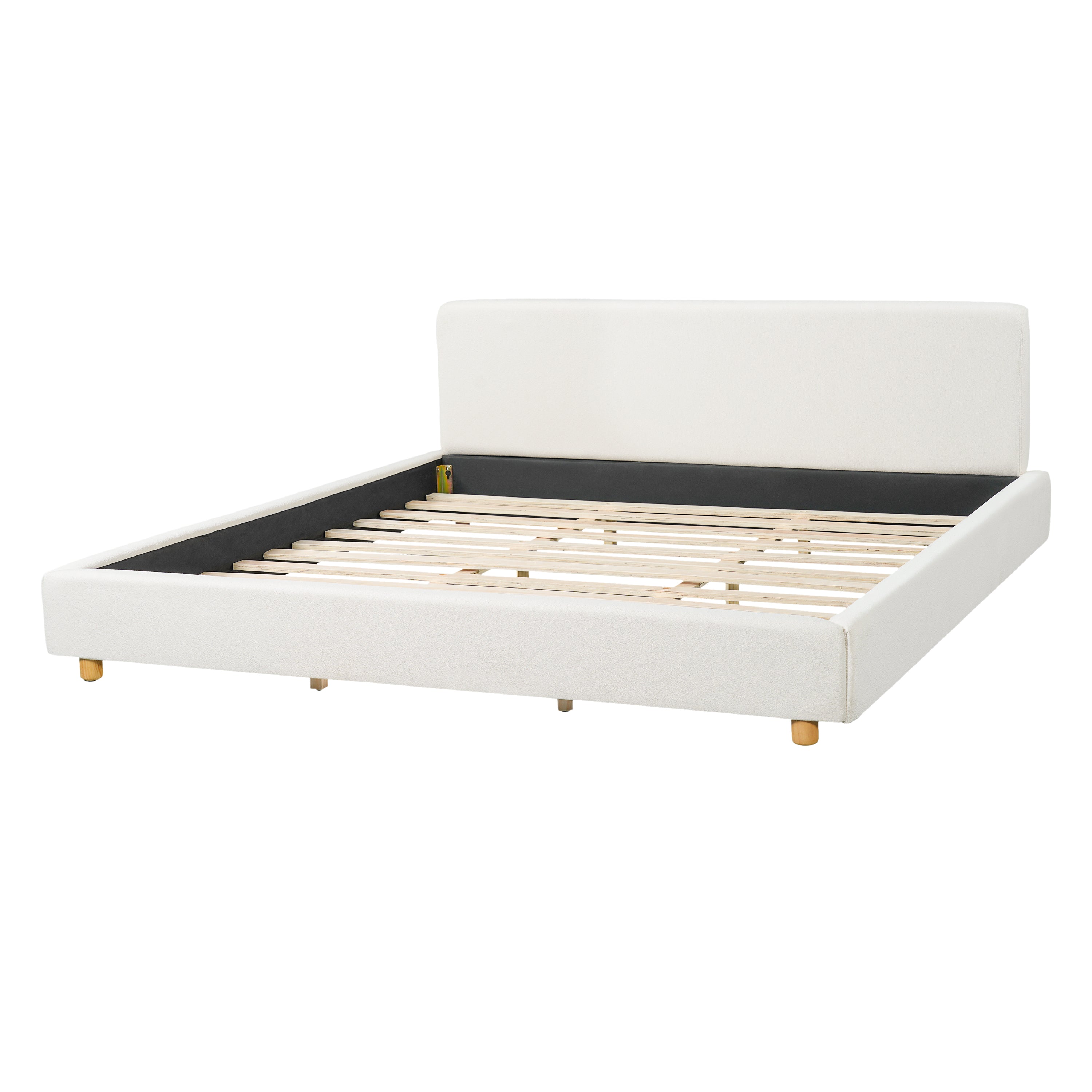 King white boucle upholstered platform bed, low-profile corner view