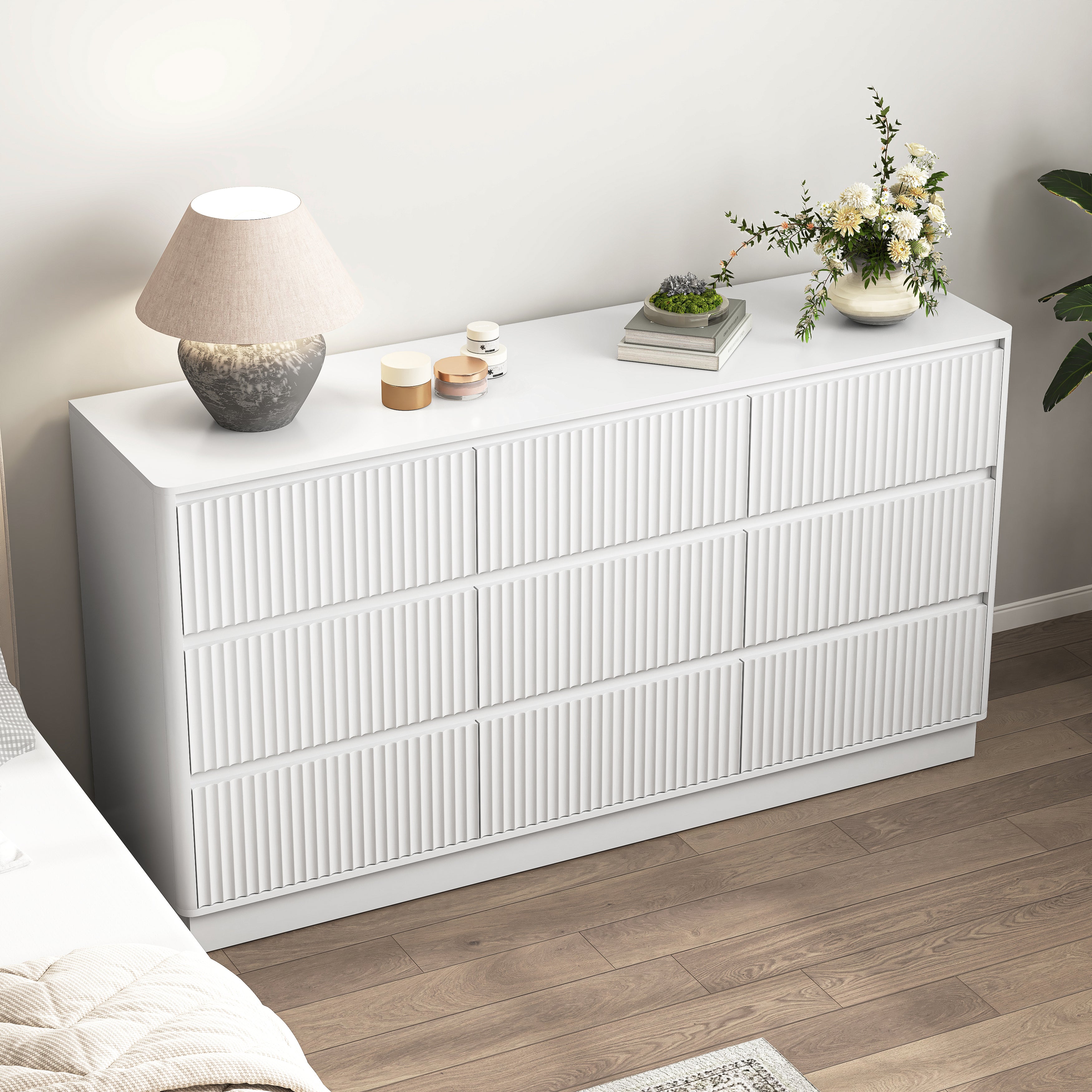 White mid-century 9 drawer chest used as a long TV stand, styled room view