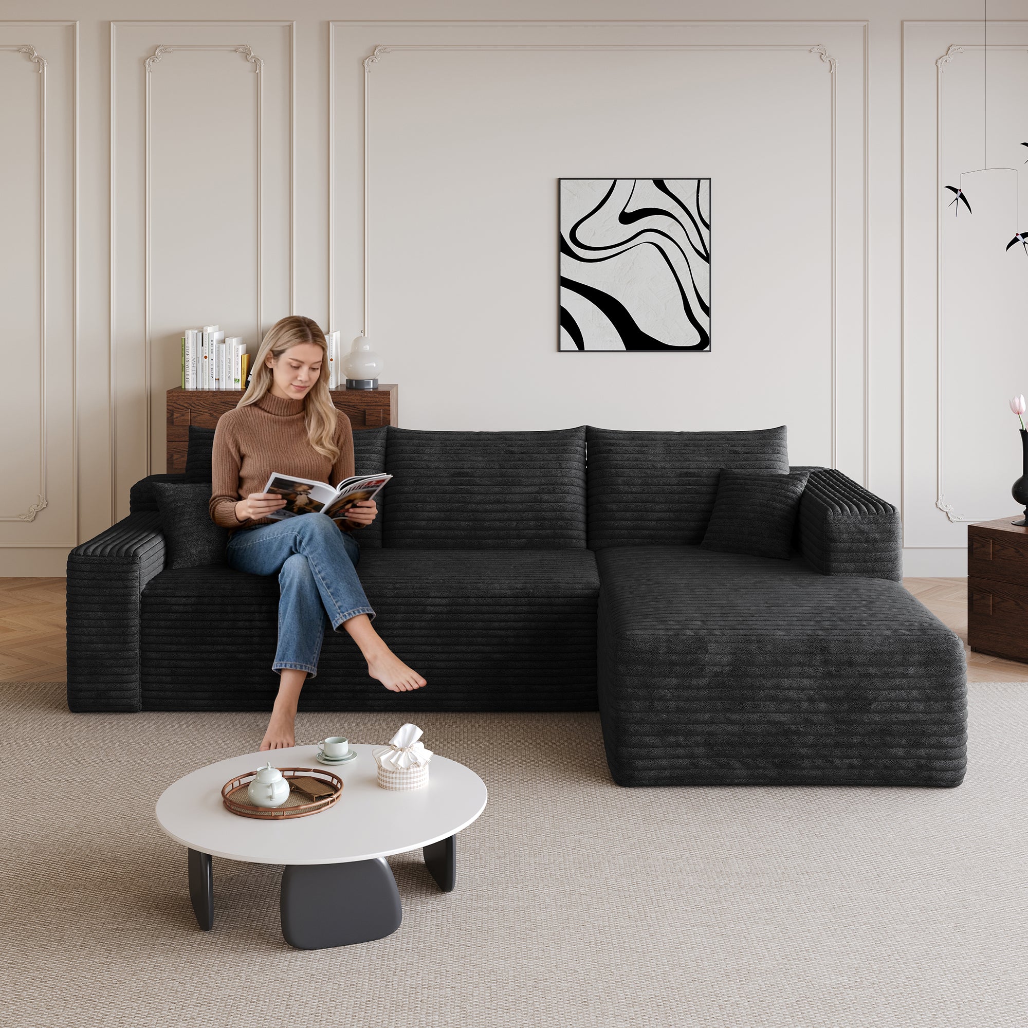Black corduroy U-shaped sectional sofa, angled view