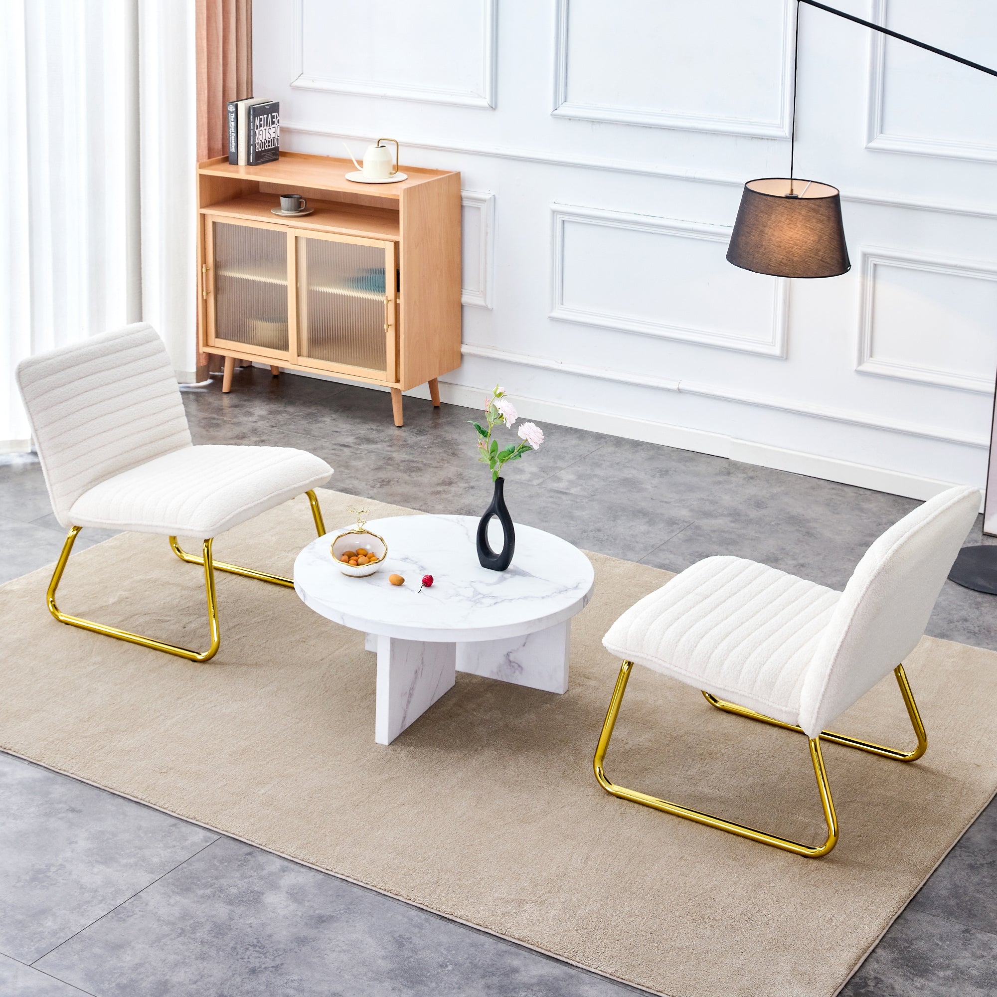 One White minimalist armless sofa chair with plush cushion and backrest paired with golden metal legs, suitable for offices, restaurants, kitchens, bedrooms