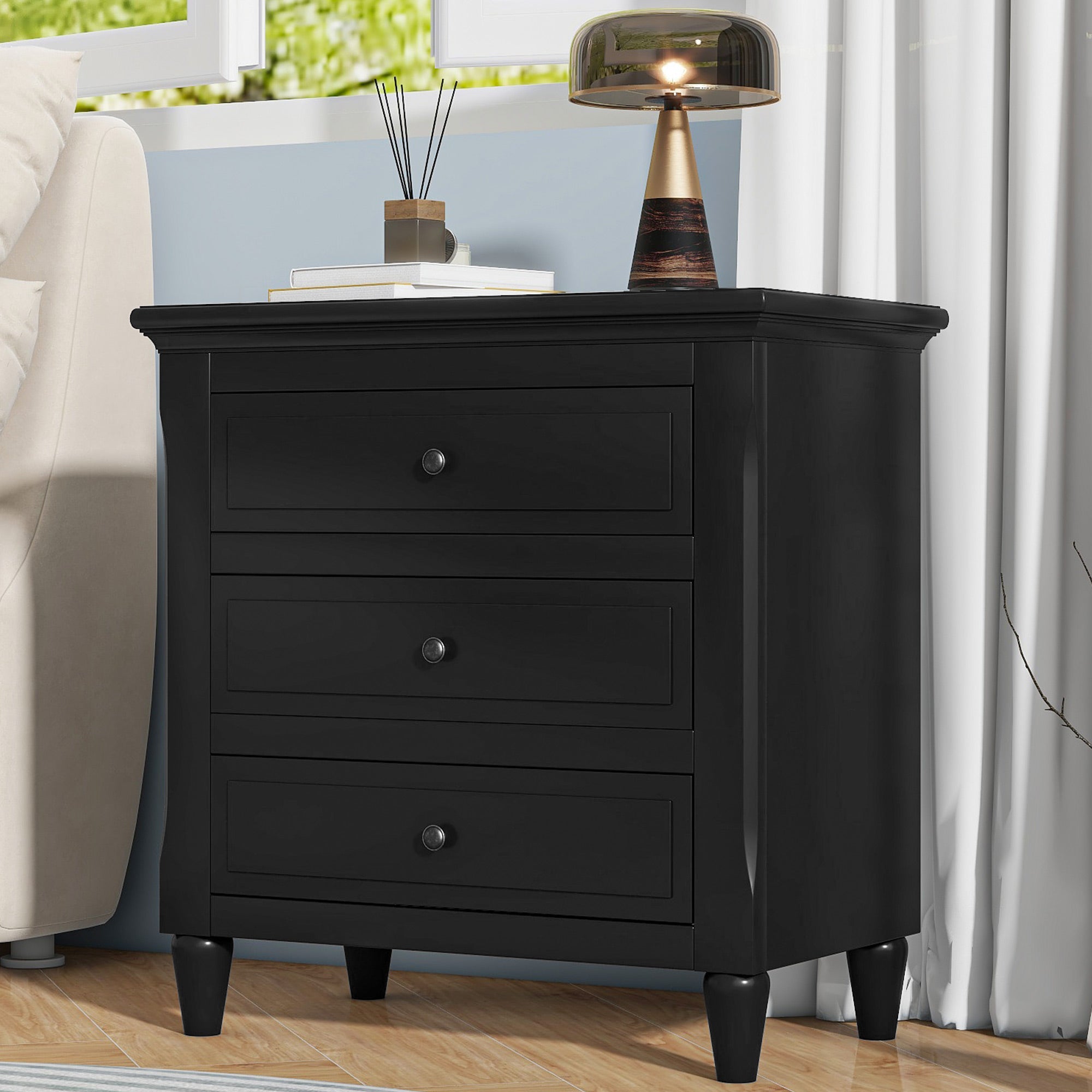 Painted 3-drawer bedside cabinet with metal handles, angled view