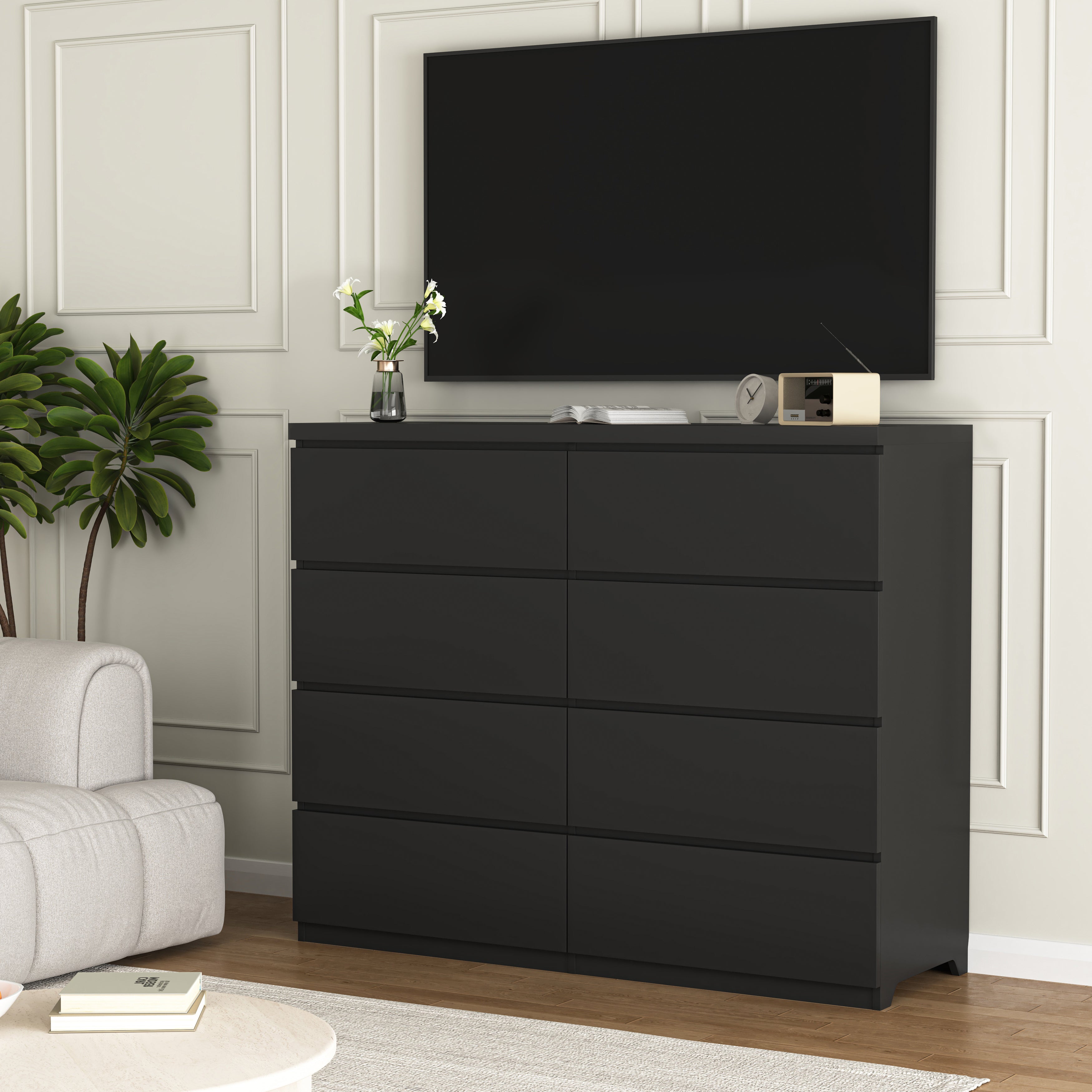 Tall black wood dresser with drawers open, storage detail