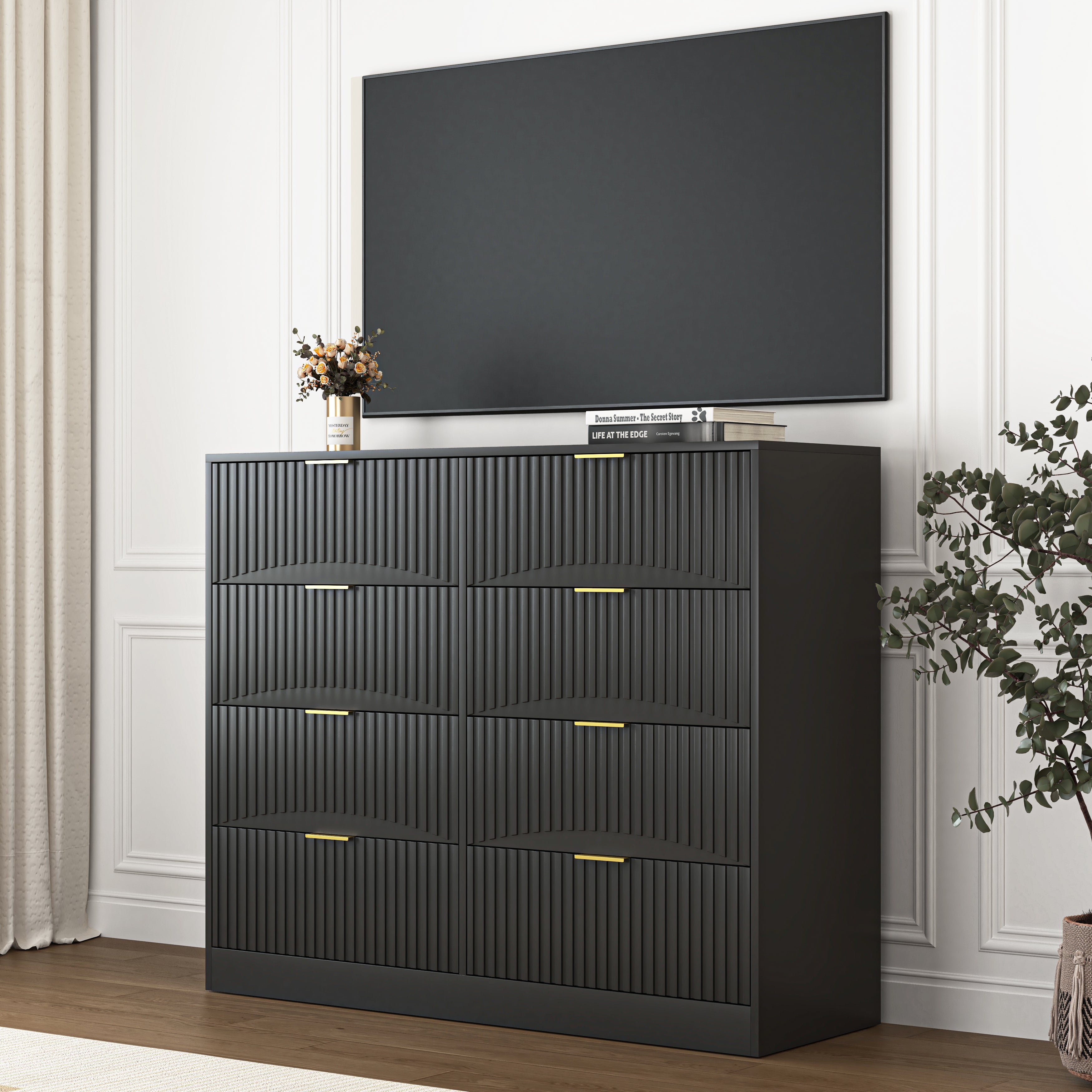 Black wood 8-drawer dresser with gold metal handle close-up detail