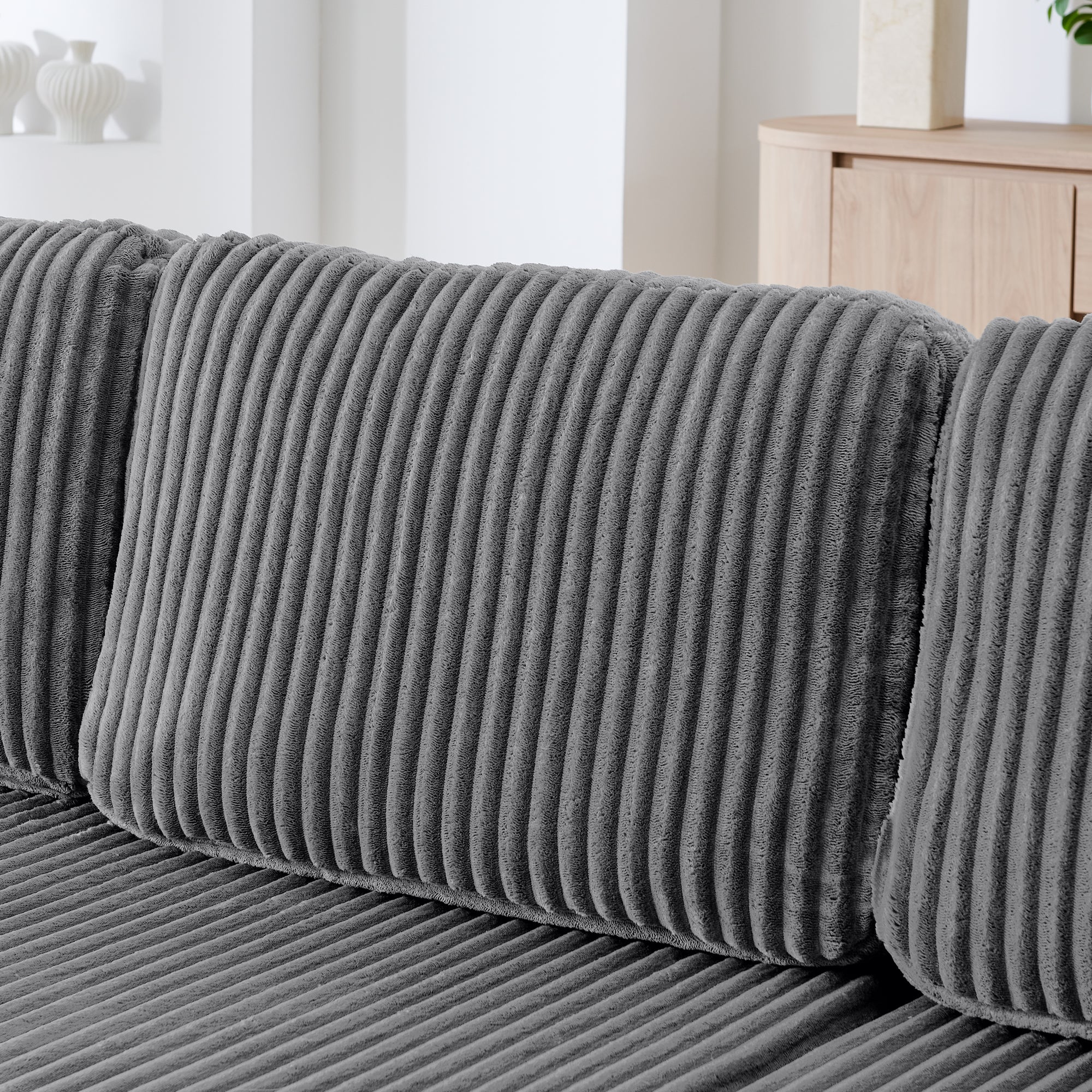 Grey U-shape modular sleeper sofa in living room setting