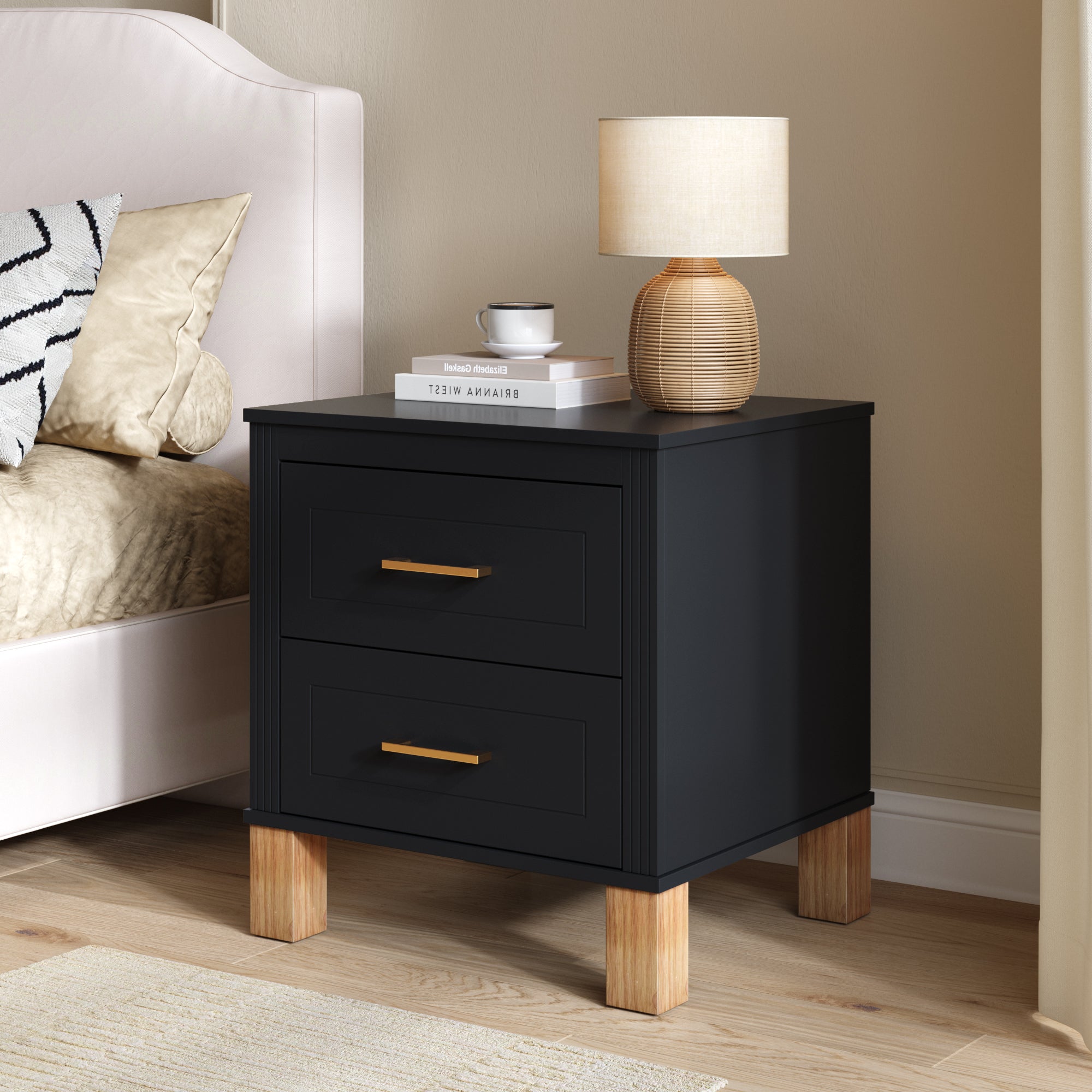Black fluted bedside table with metal drawer handles, angled view