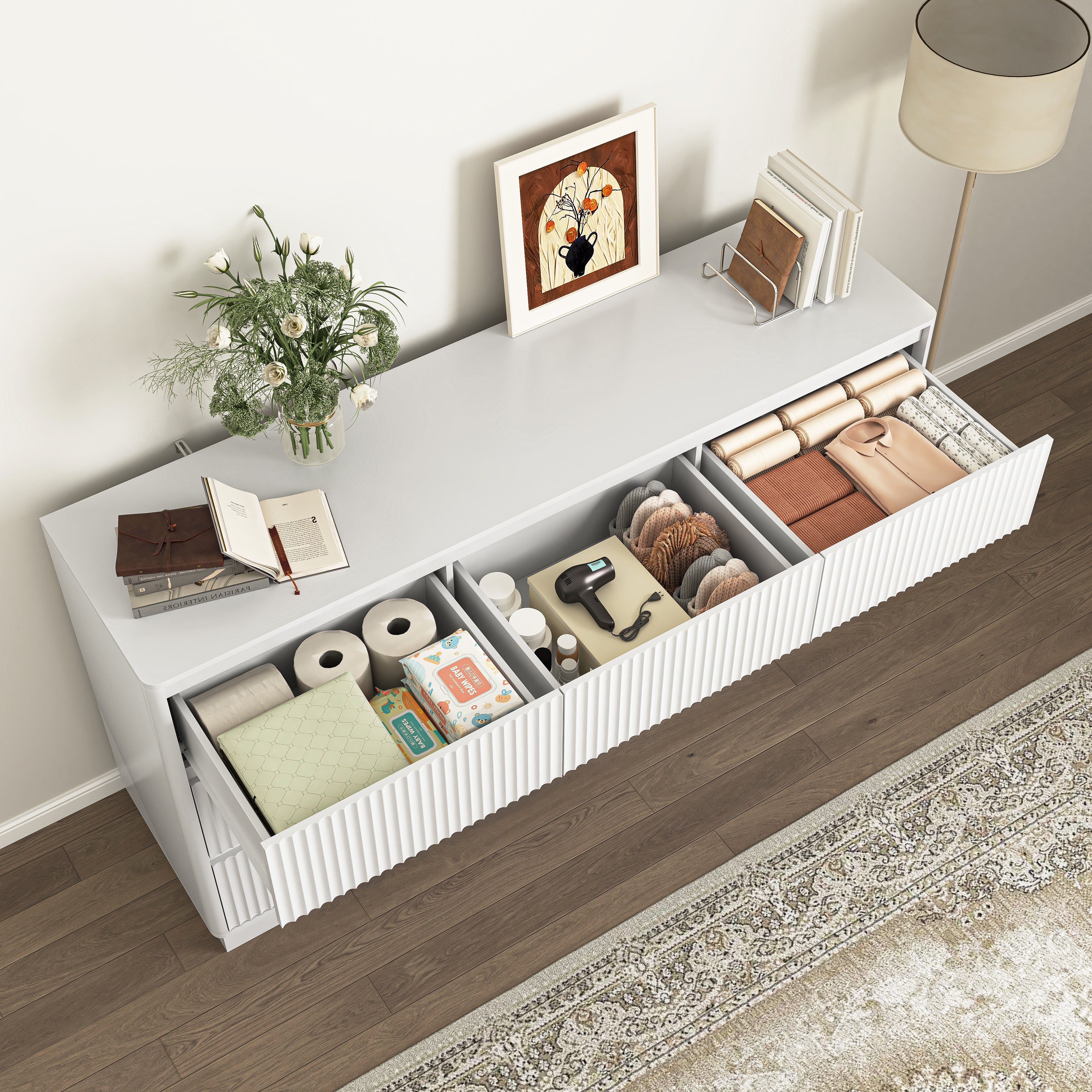 White wood chest of drawers in bedroom setting, room view