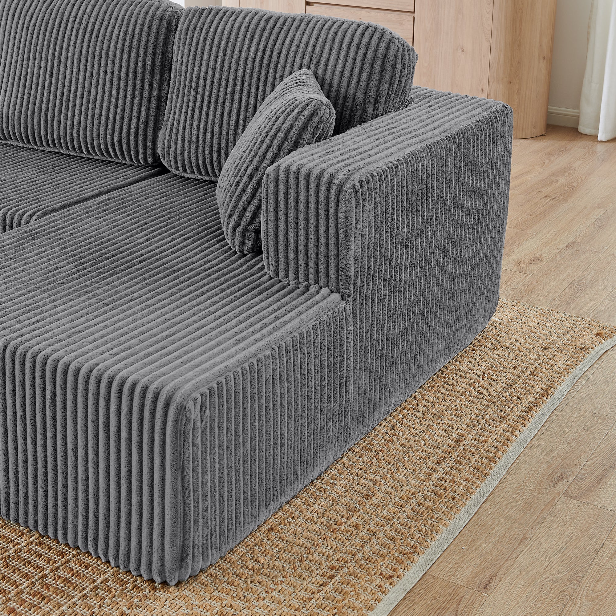 Grey corduroy sectional sofa, seating and cushion close-up