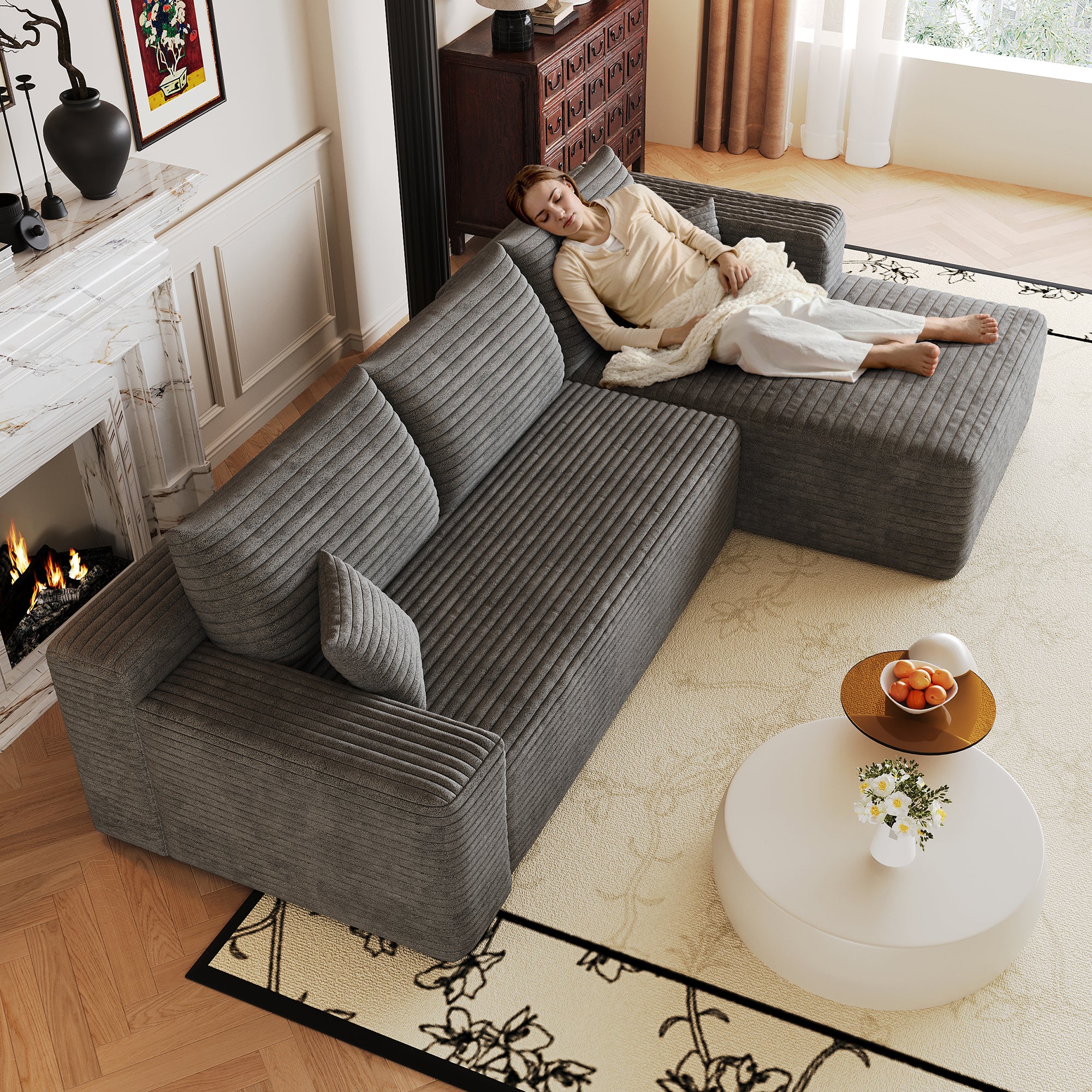 Plush corduroy fabric texture detail, dark grey sectional sofa