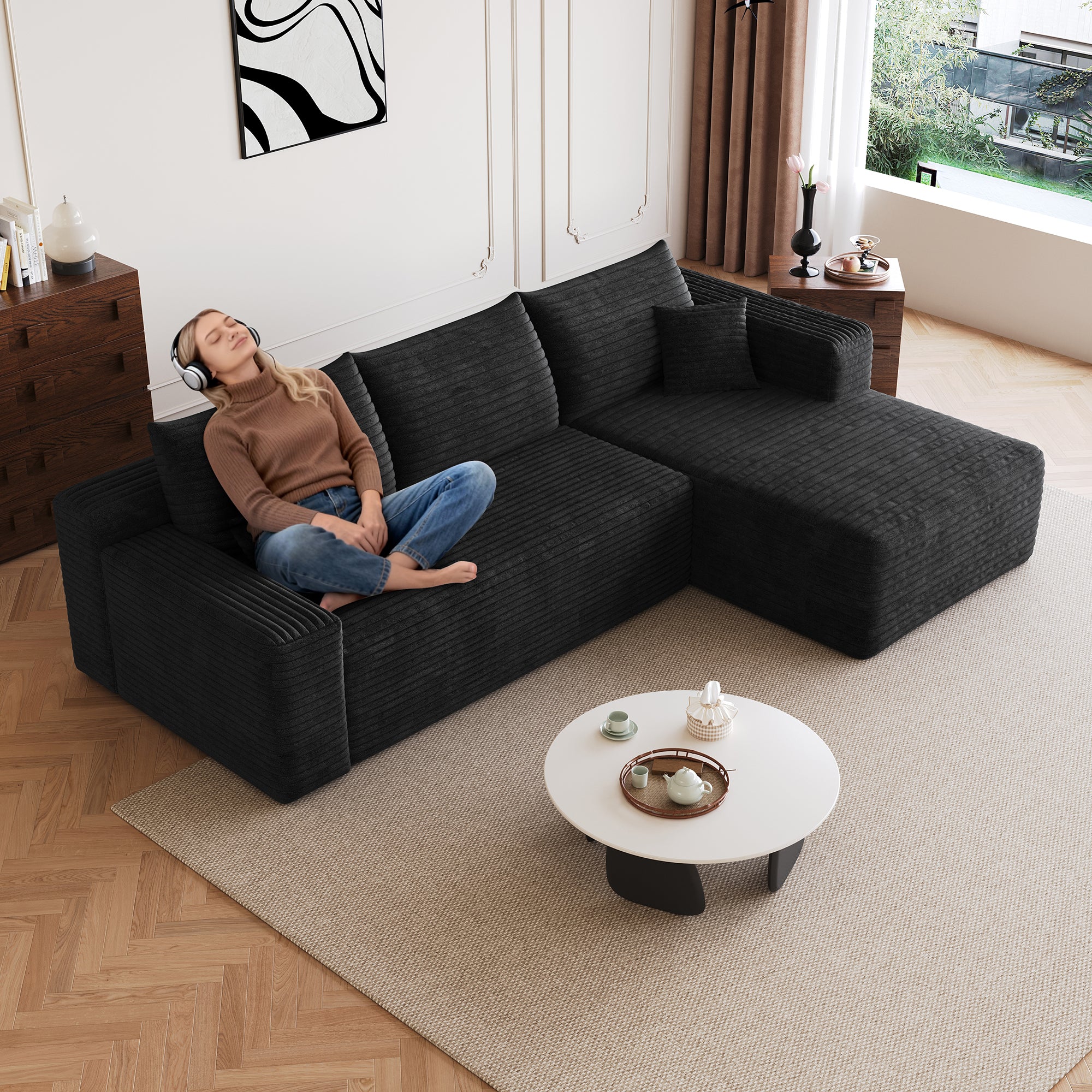 Deep-seat black corduroy corner sectional sofa, side view