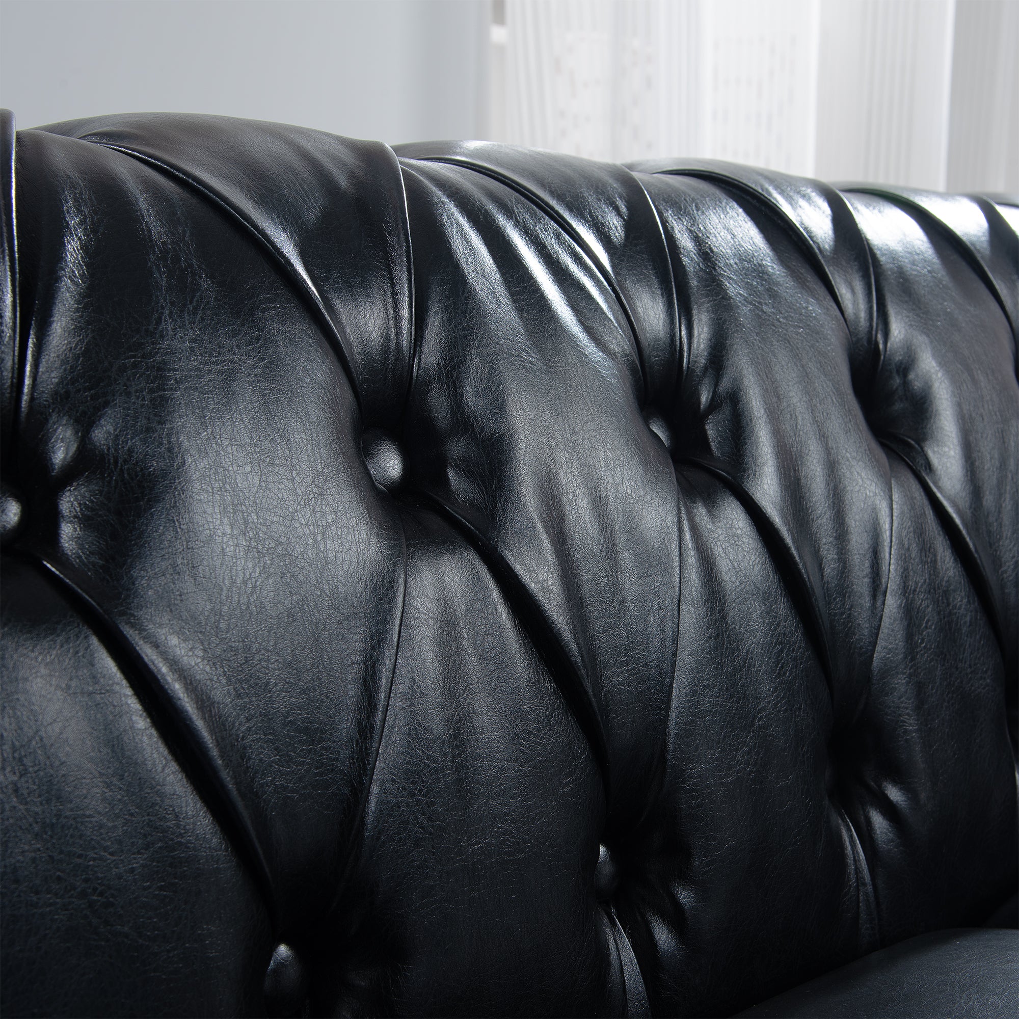 84.65" BLACK PU Rolled Arm Chesterfield Three Seater Sofa.