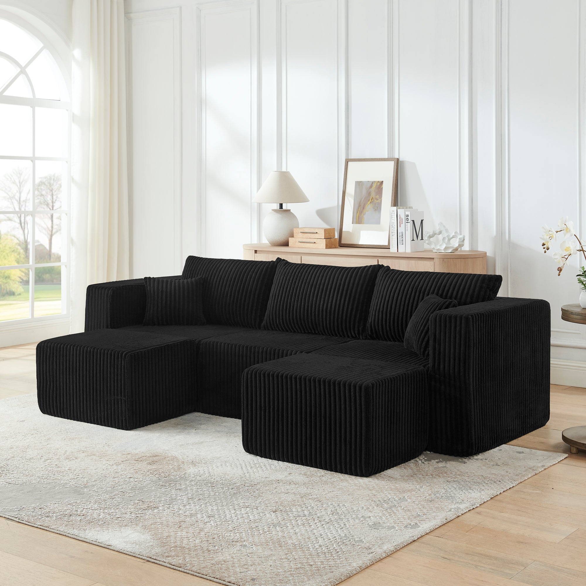 Compact modular corduroy sectional sofa in black, front view