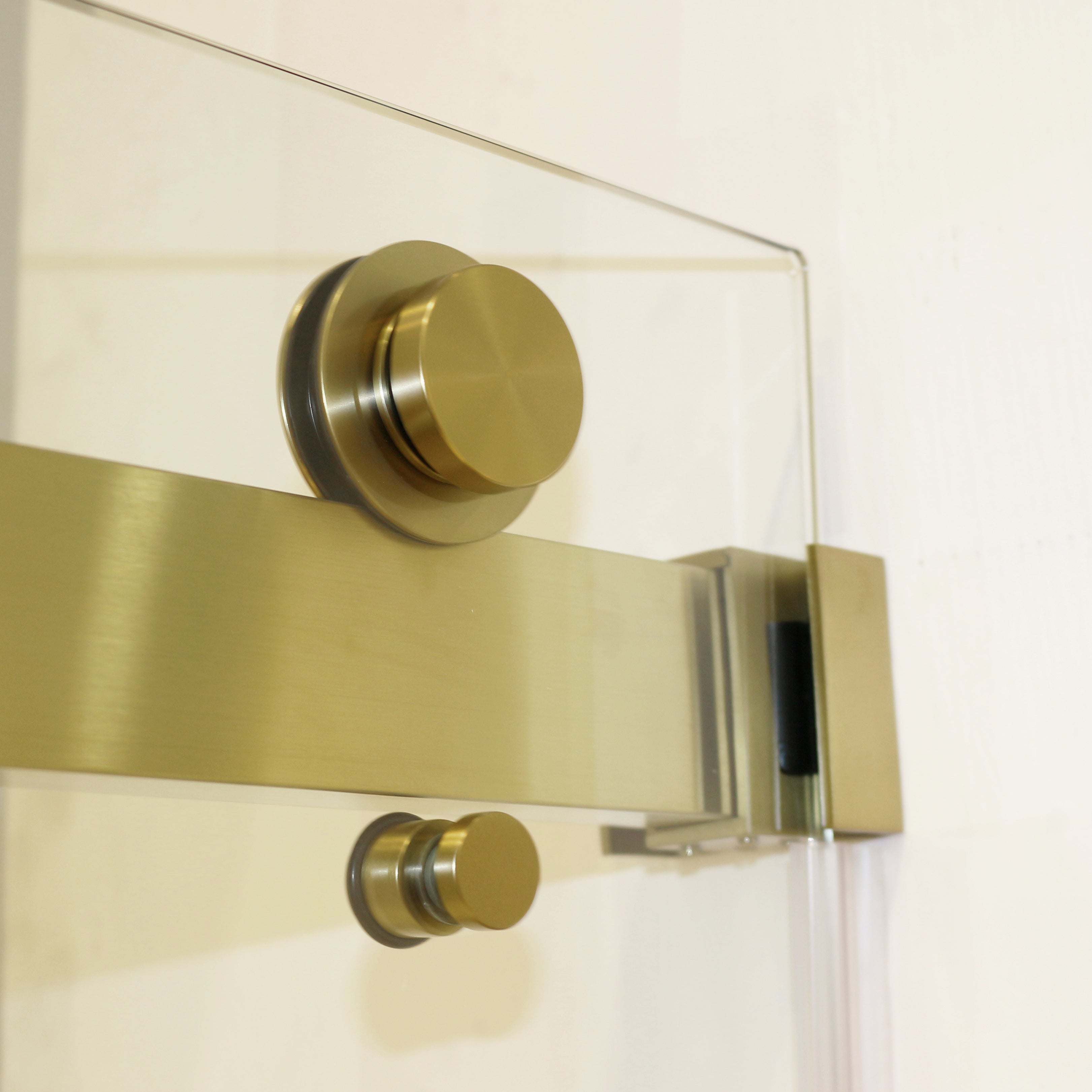Frameless sliding shower door 72 in brushed gold installed side view