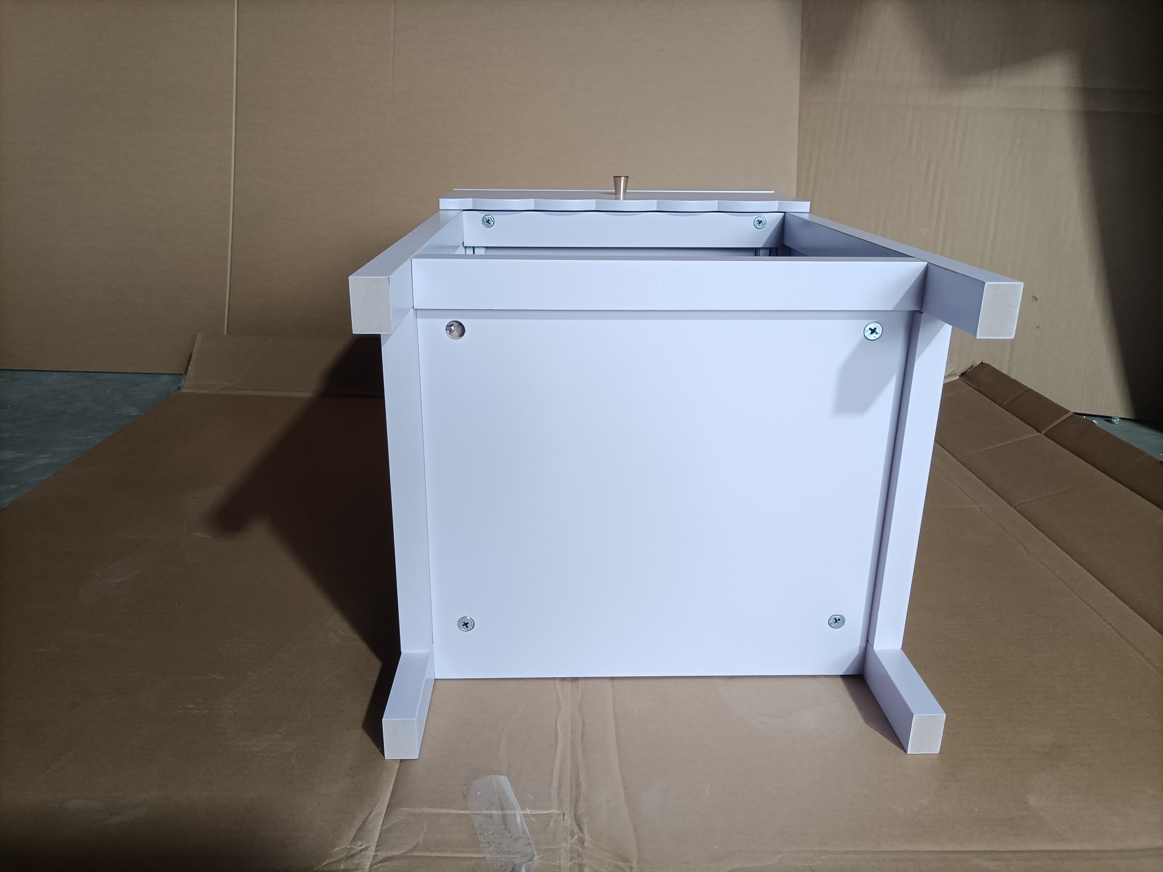 Light purple scalloped nightstand styled in a girls' bedroom