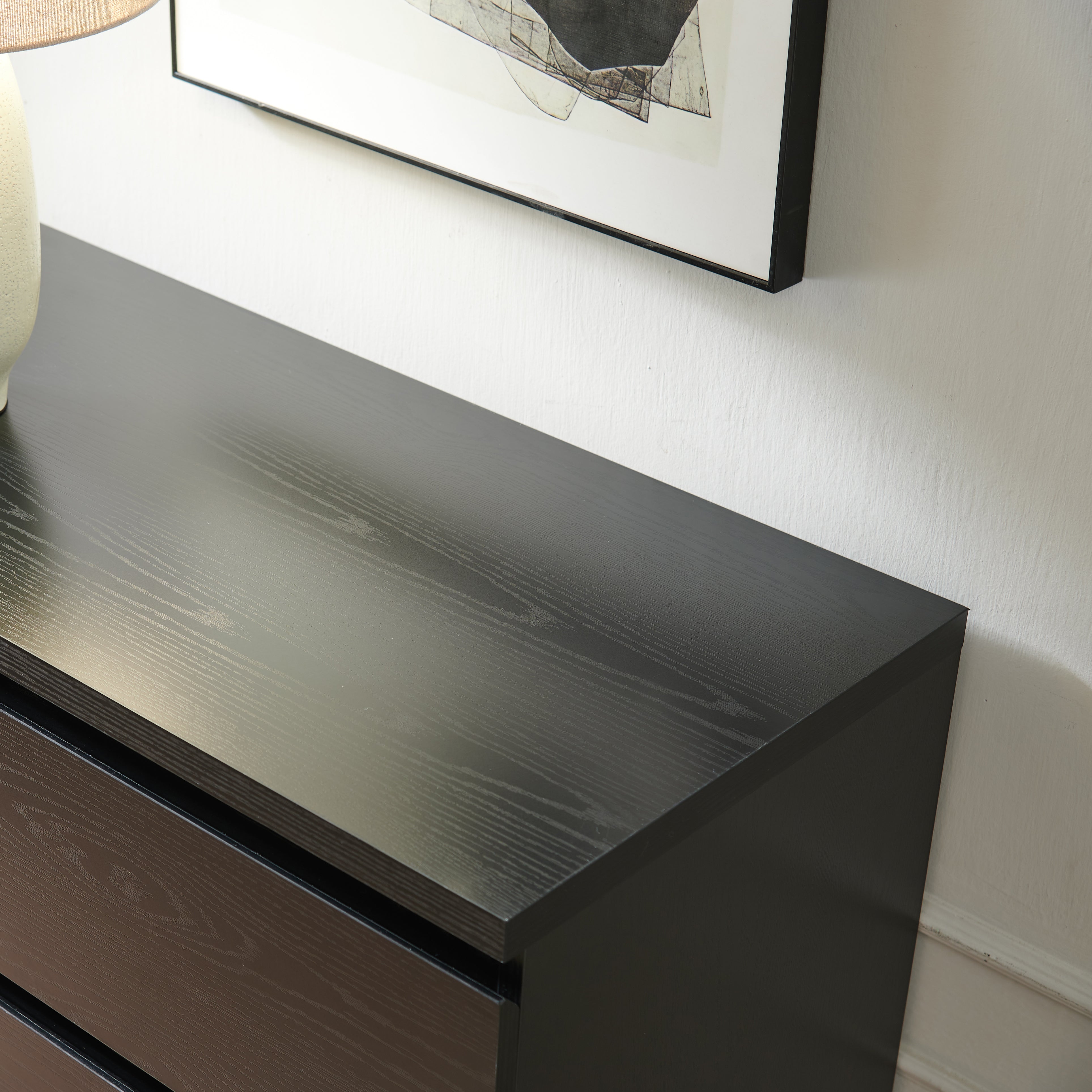 Modern black 4-drawer storage dresser, detail view
