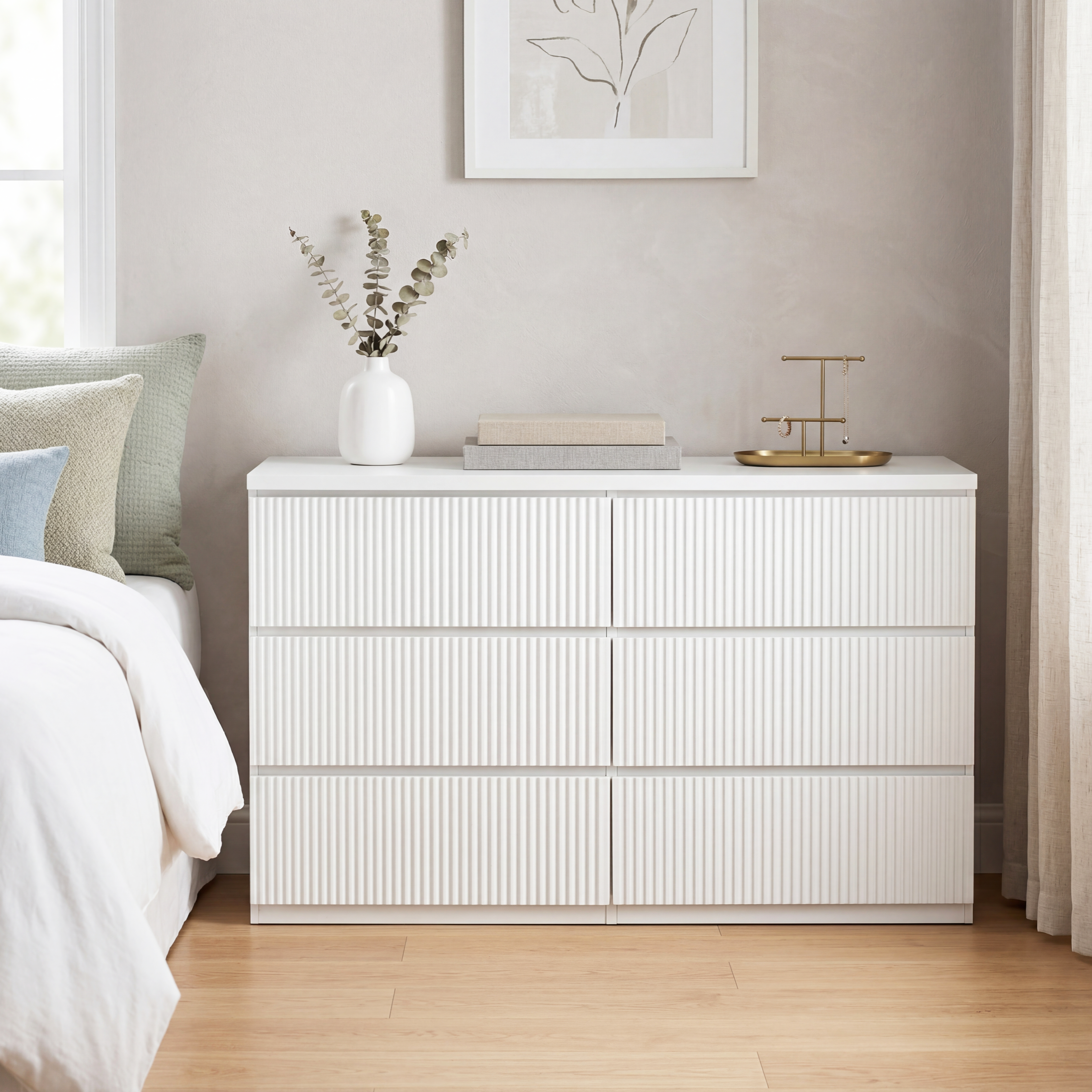White 6-drawer dresser with wave panel drawer fronts, close-up texture