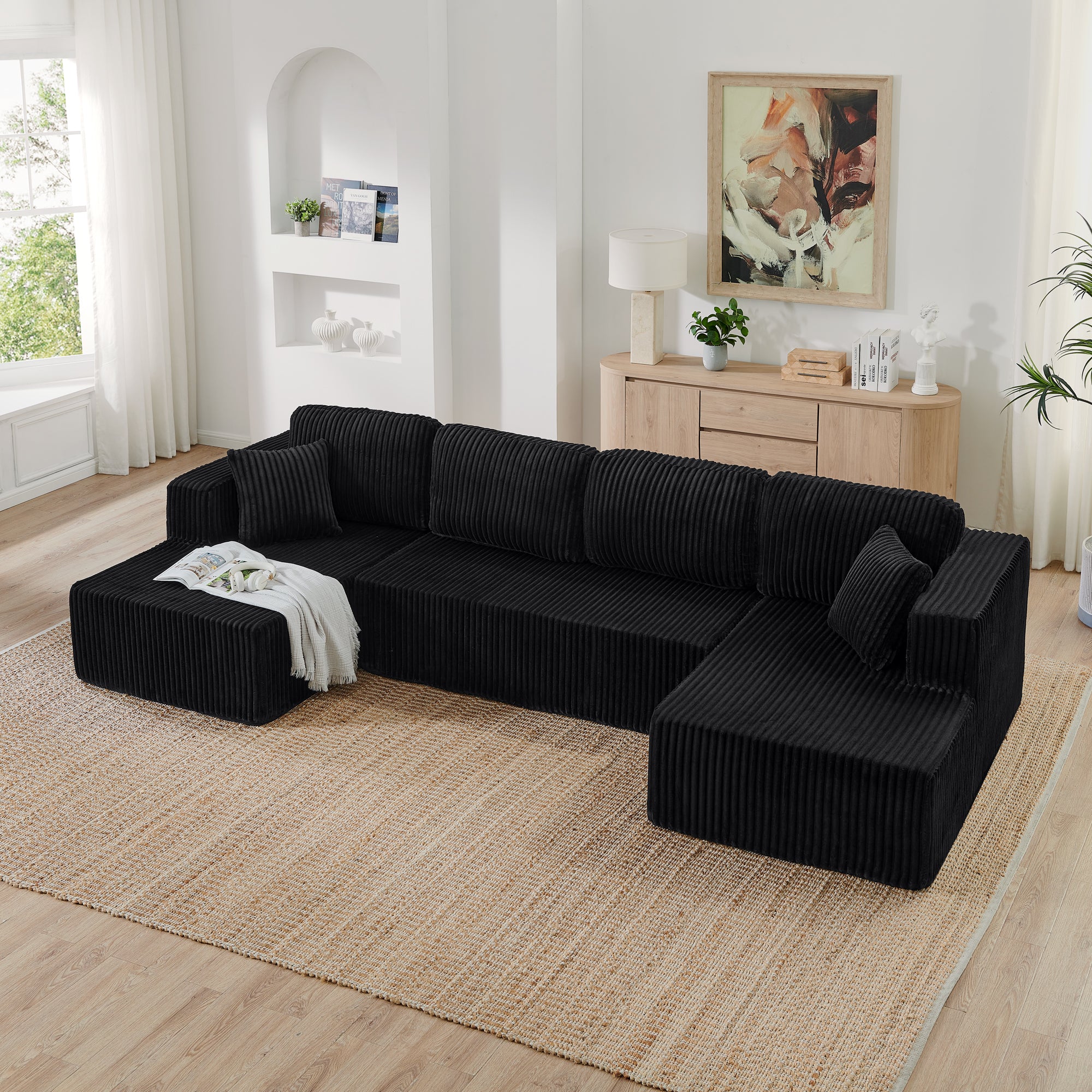 Black corduroy U-shape sectional sofa, angled side view