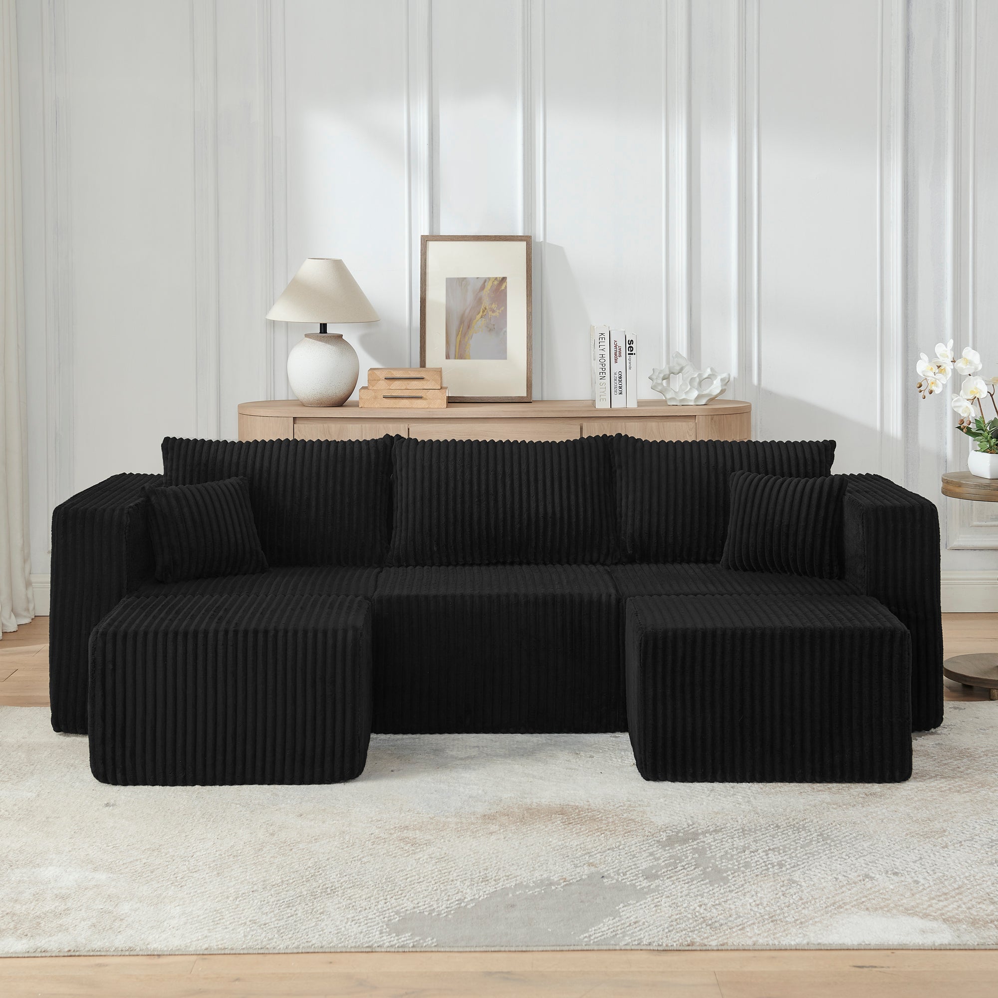 Modular corduroy sectional sofa in black, corner configuration view