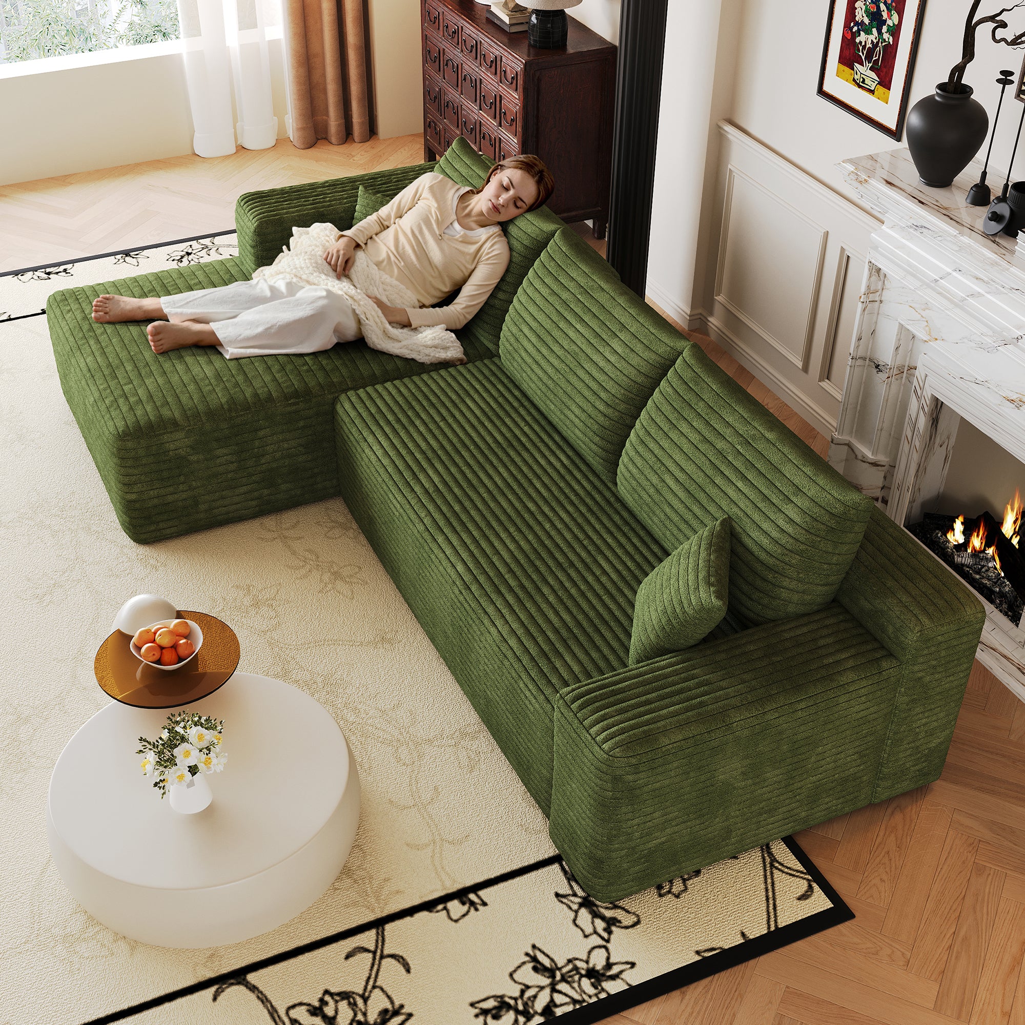 Green corduroy cloud sectional sofa in living room setting
