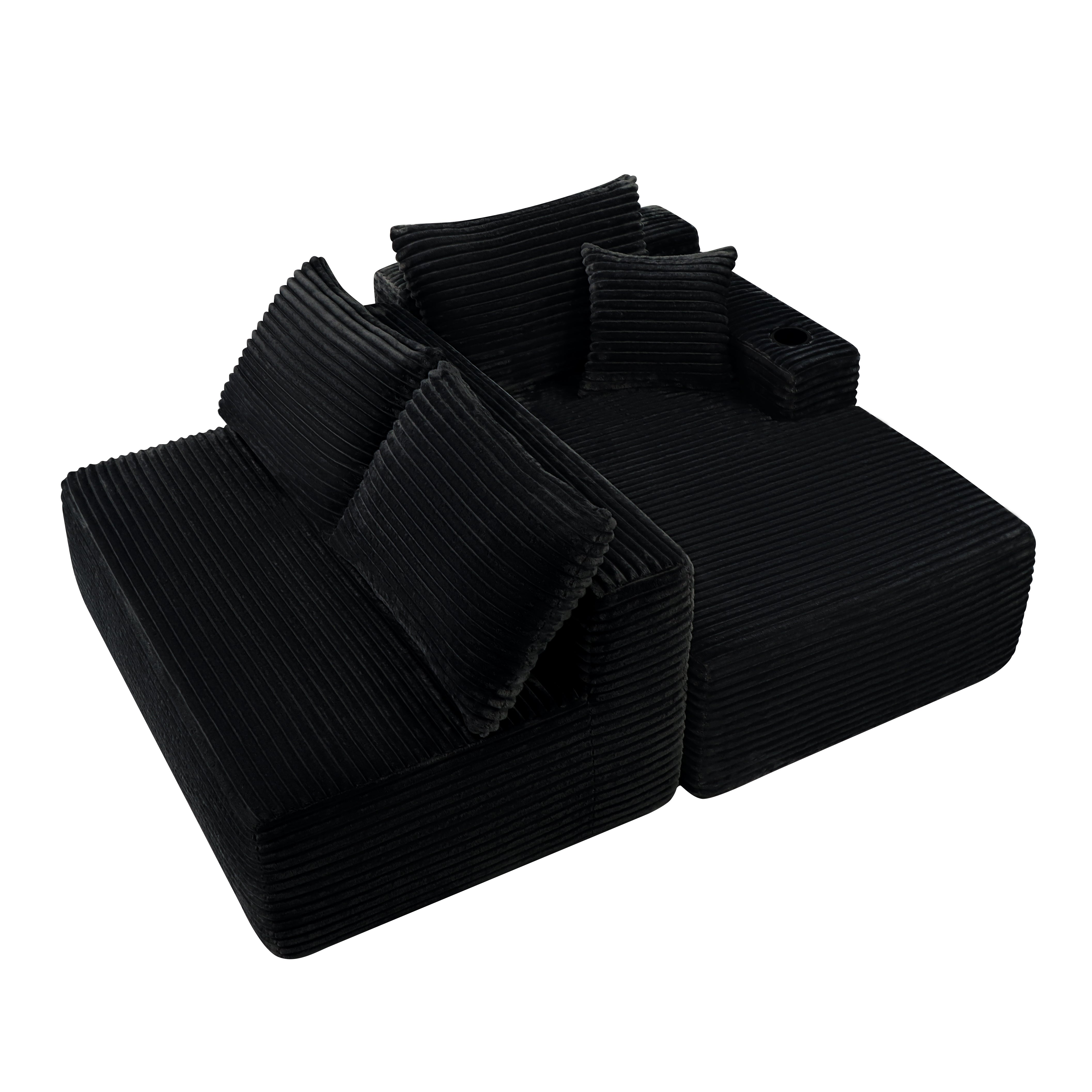 96-inch black plush cloud sectional sofa in living room setting