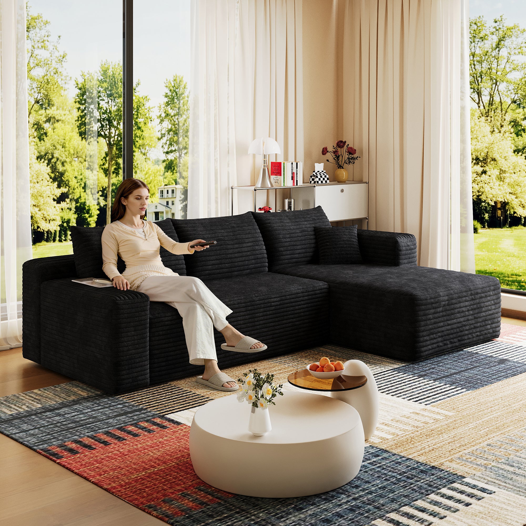 Black corduroy U-shaped sectional sofa, angled corner view