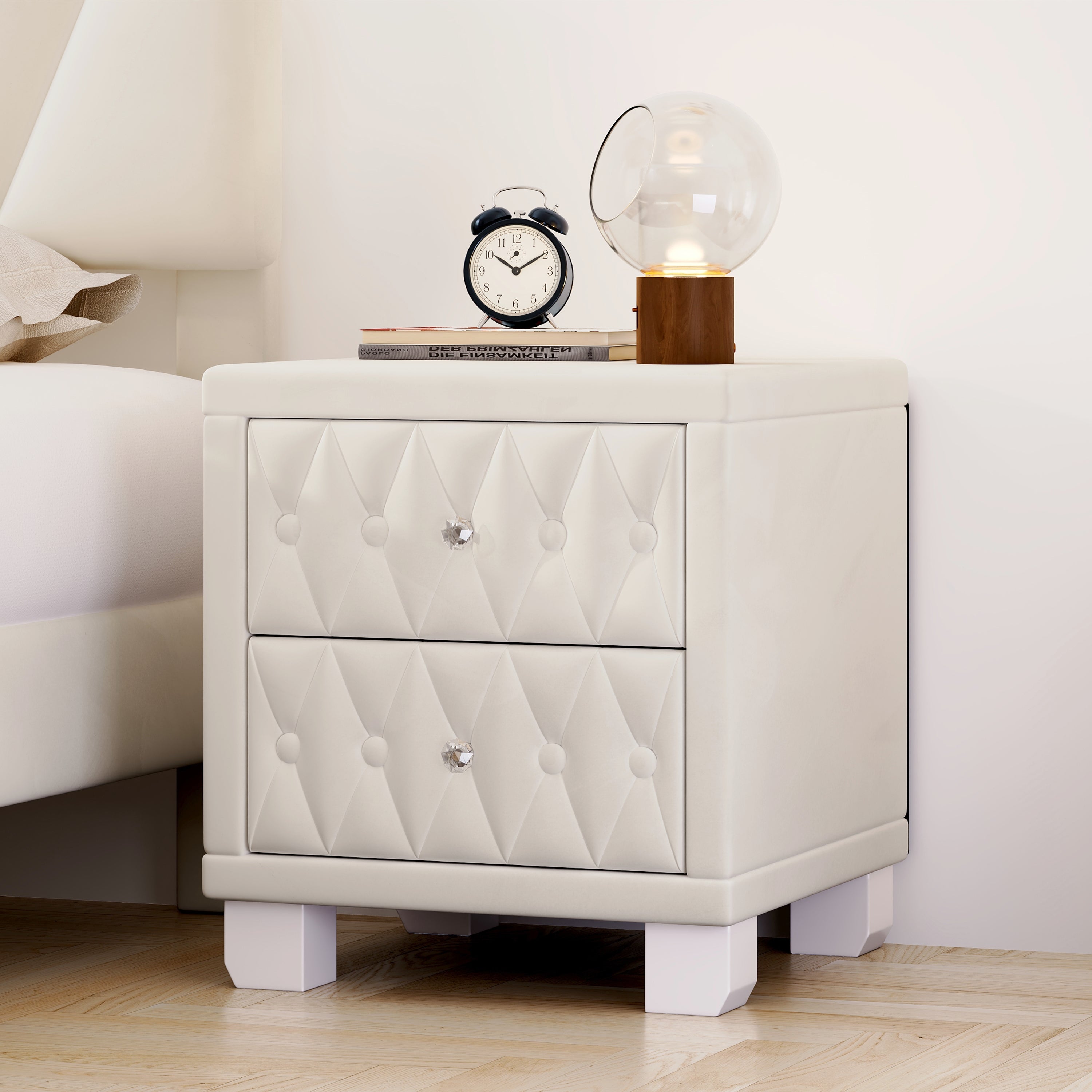 Beige velvet bedside table with drawers open, storage view