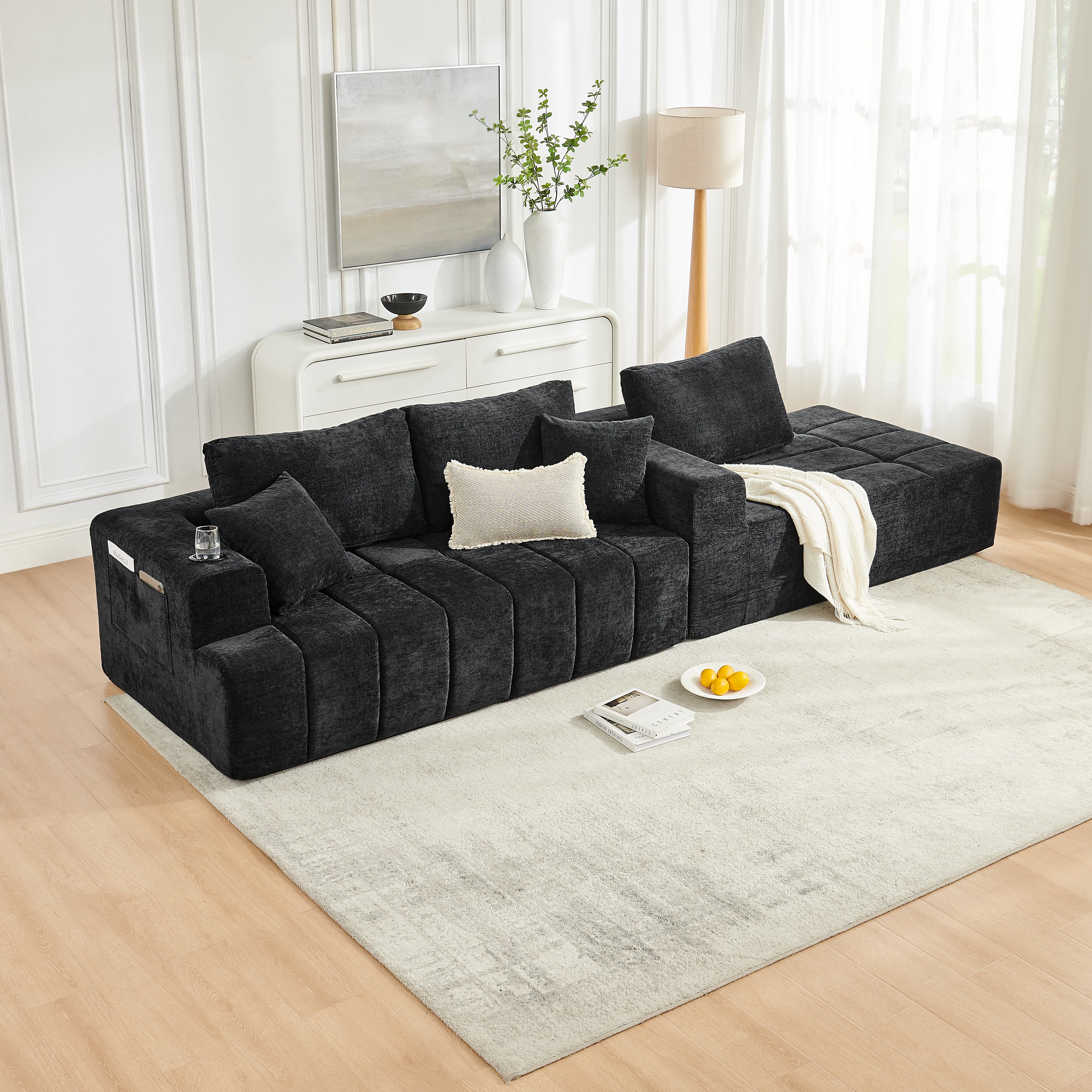 L-shaped black sectional sofa chaise detail, side view