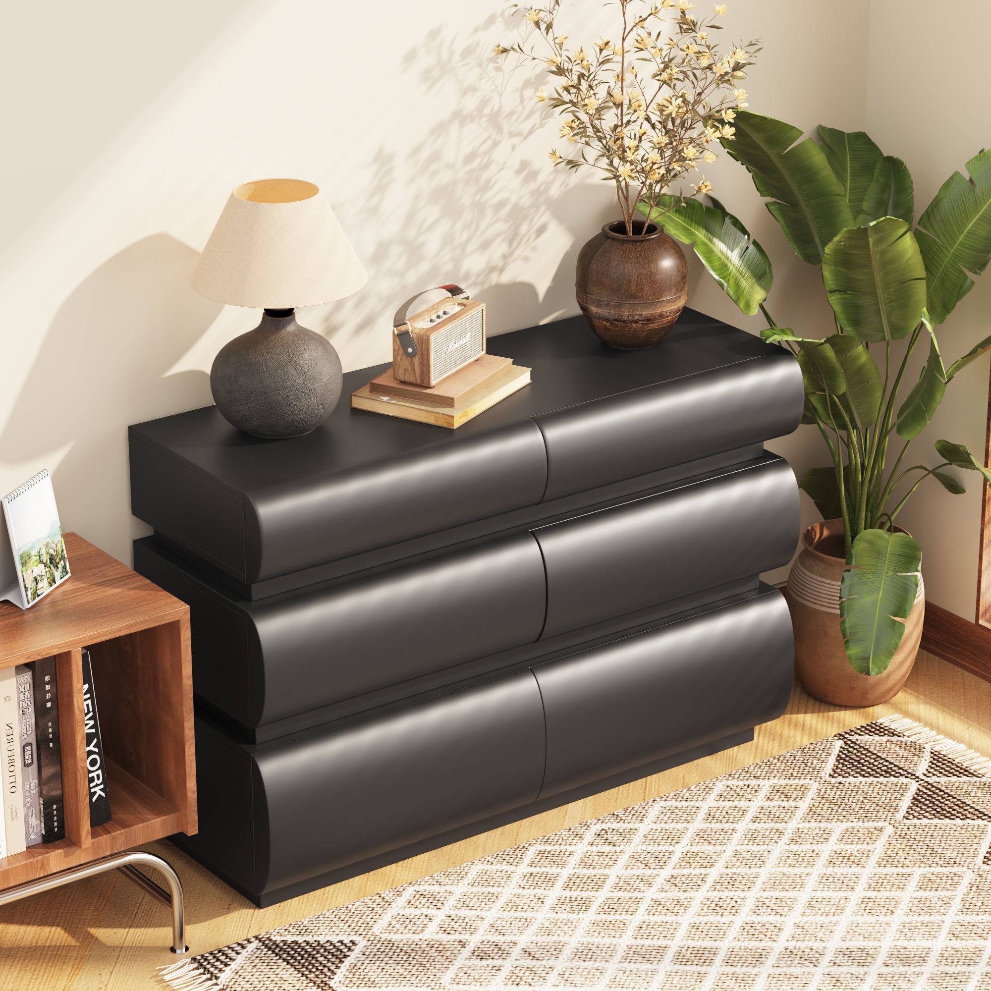 Modern black chest of drawers, six drawers open showing wide storage