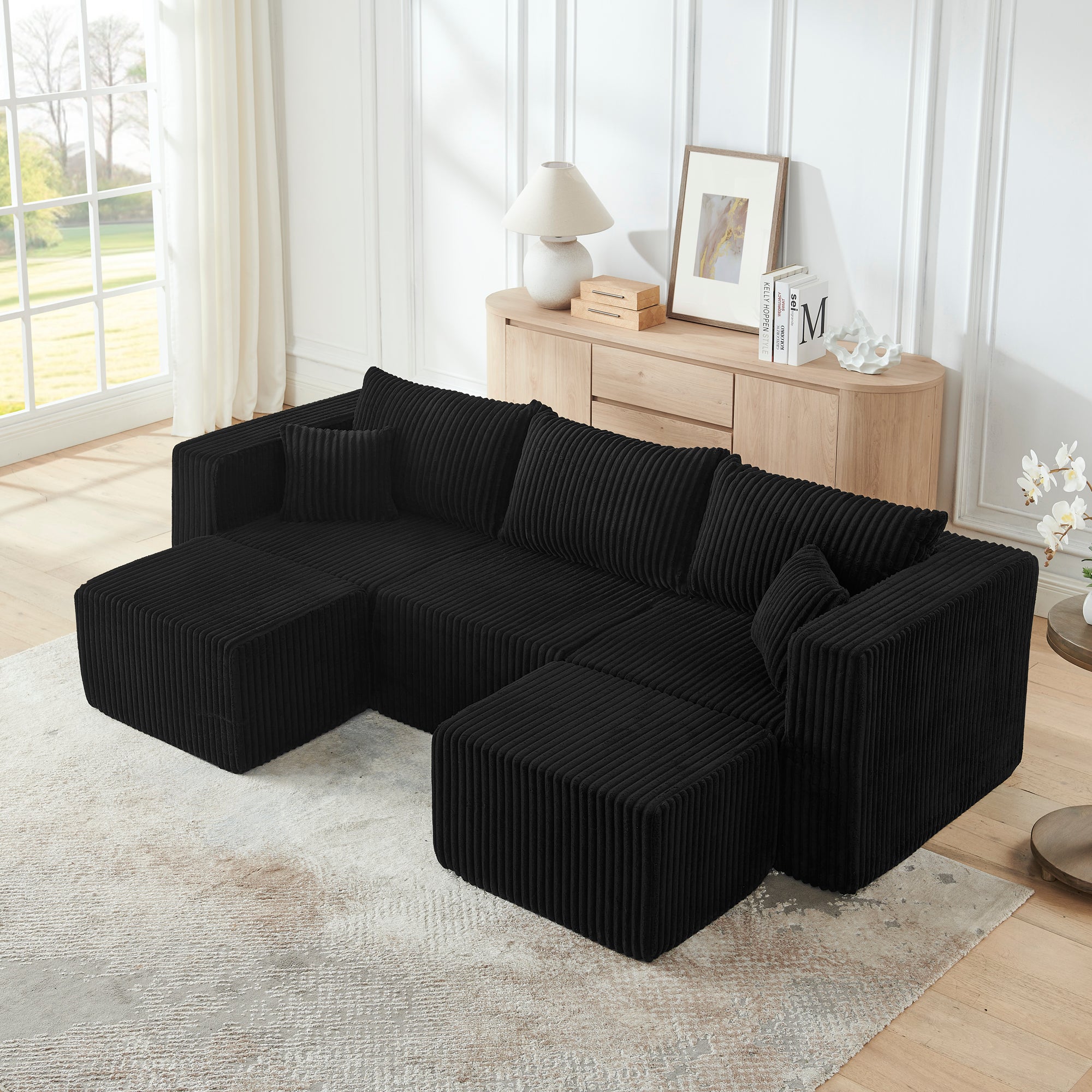 Black corduroy modular sectional sofa, angled side view