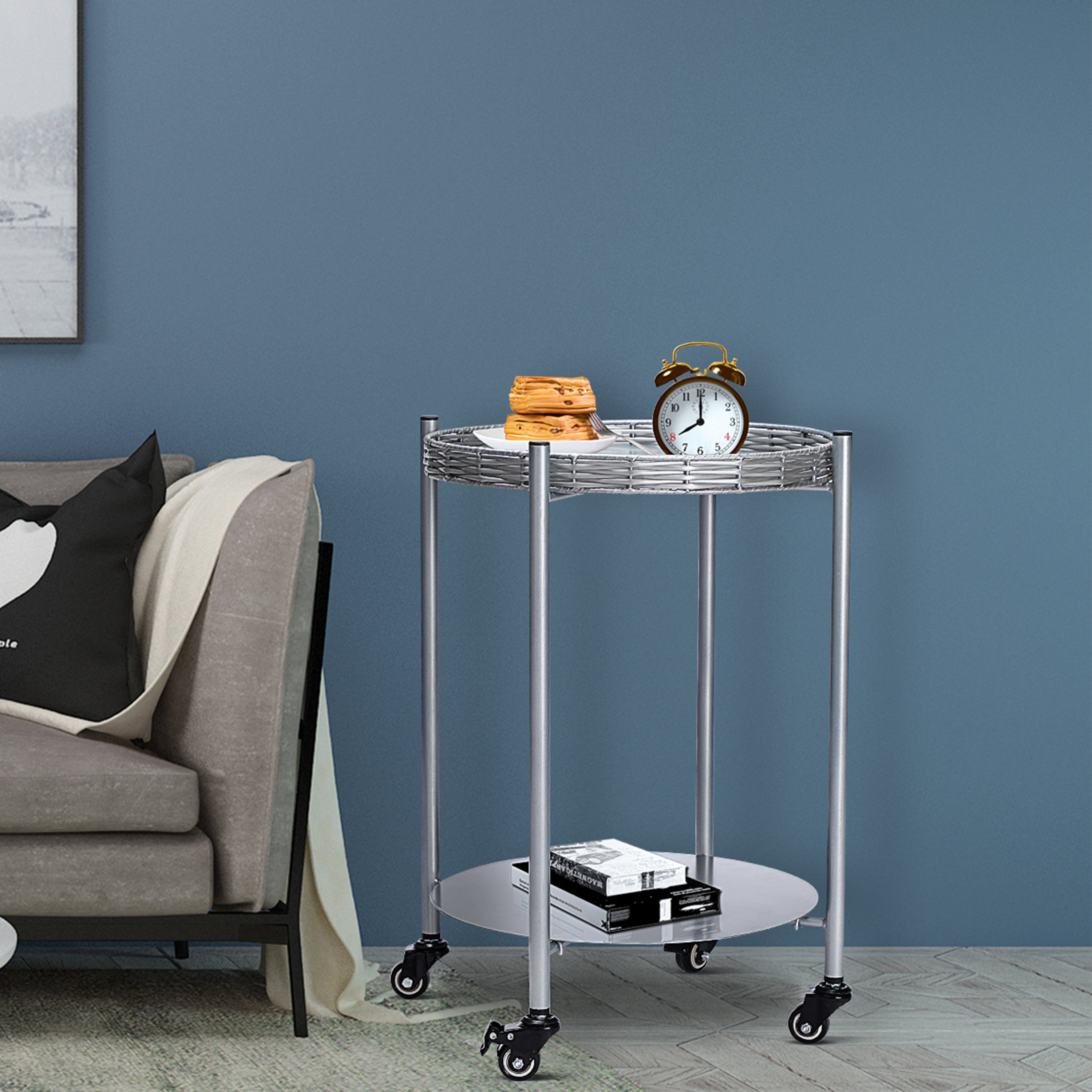 Silver gray round two-tier side table with wheels, angled view