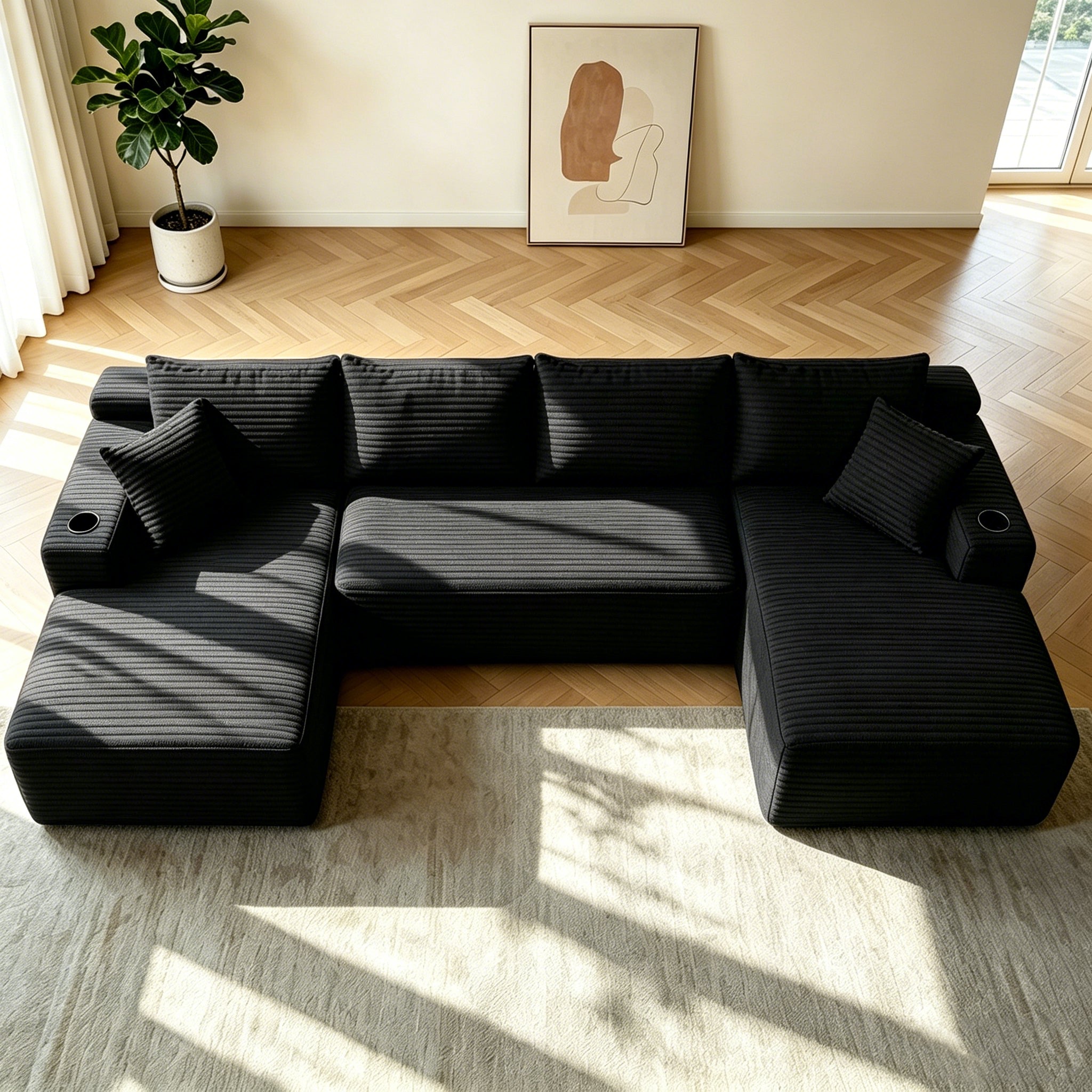 Black plush sectional sofa with deep seating, angled view
