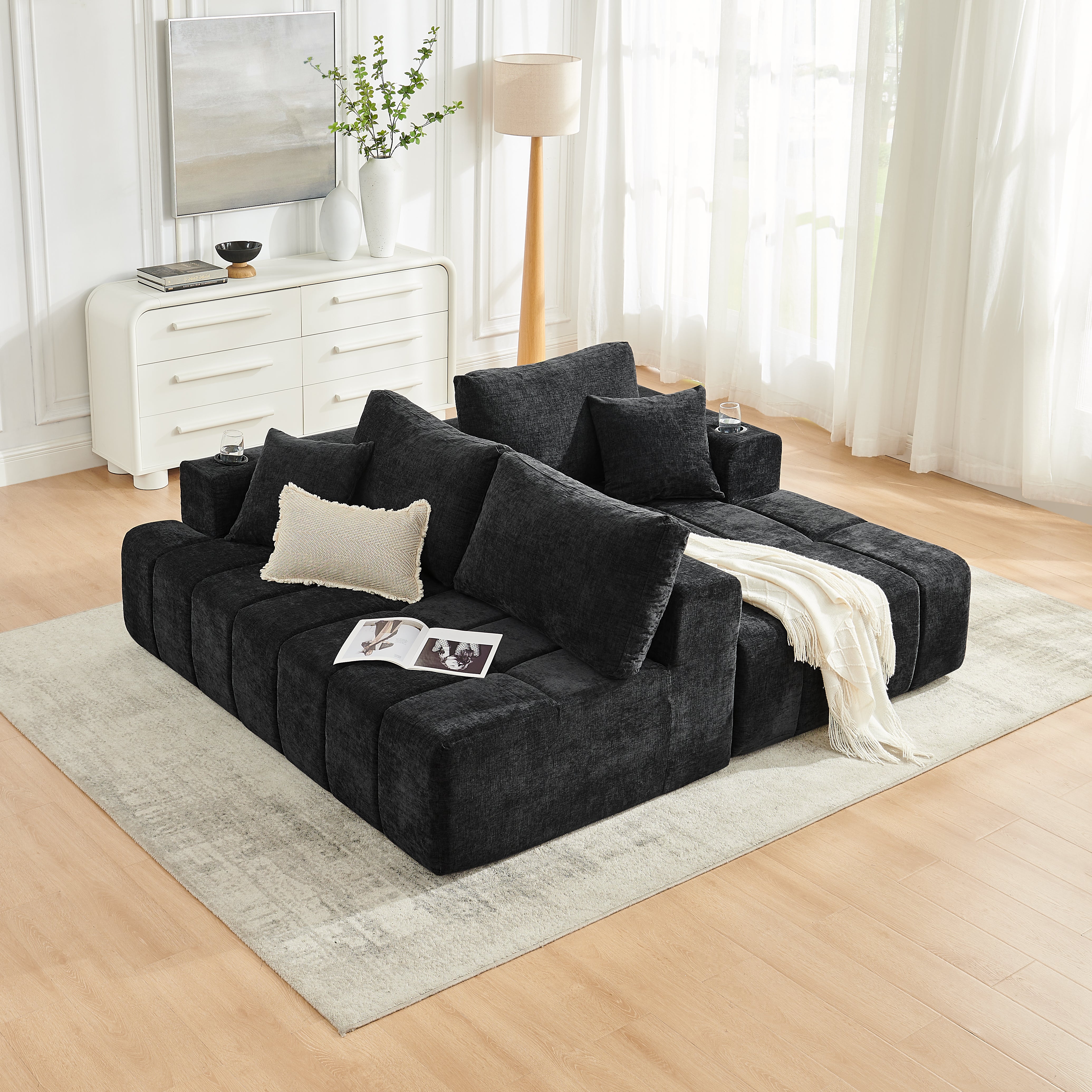 Modern black chenille L-shaped cloud sofa, full room view