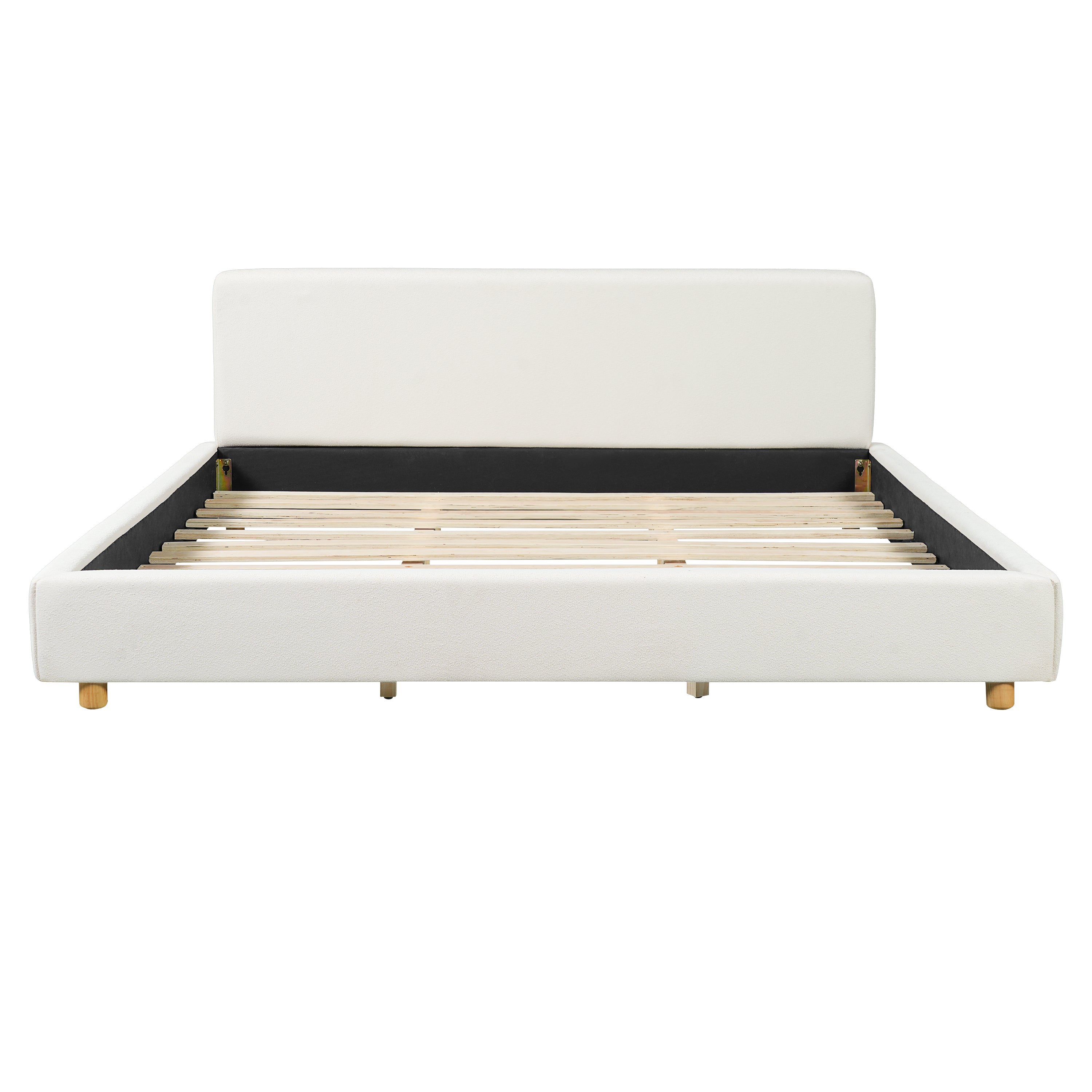 White boucle king platform bed styled in a modern bedroom setting